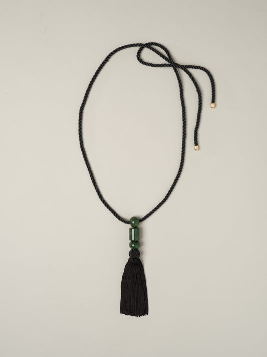 Tassel Necklace by J.McLaughlin with a woven black cord organic green stone beads and a silky black tassel
