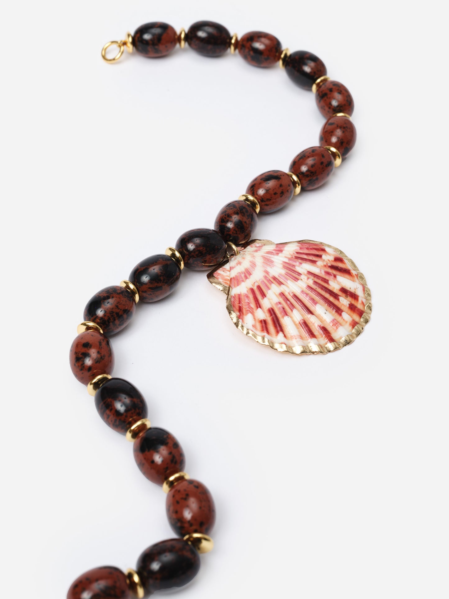 Shell Necklace featuring a polished shell pendant with gold trim, strung on a beaded strand of dark brown and reddish oval beads by J.McLaughlin, showcasing enduring design.