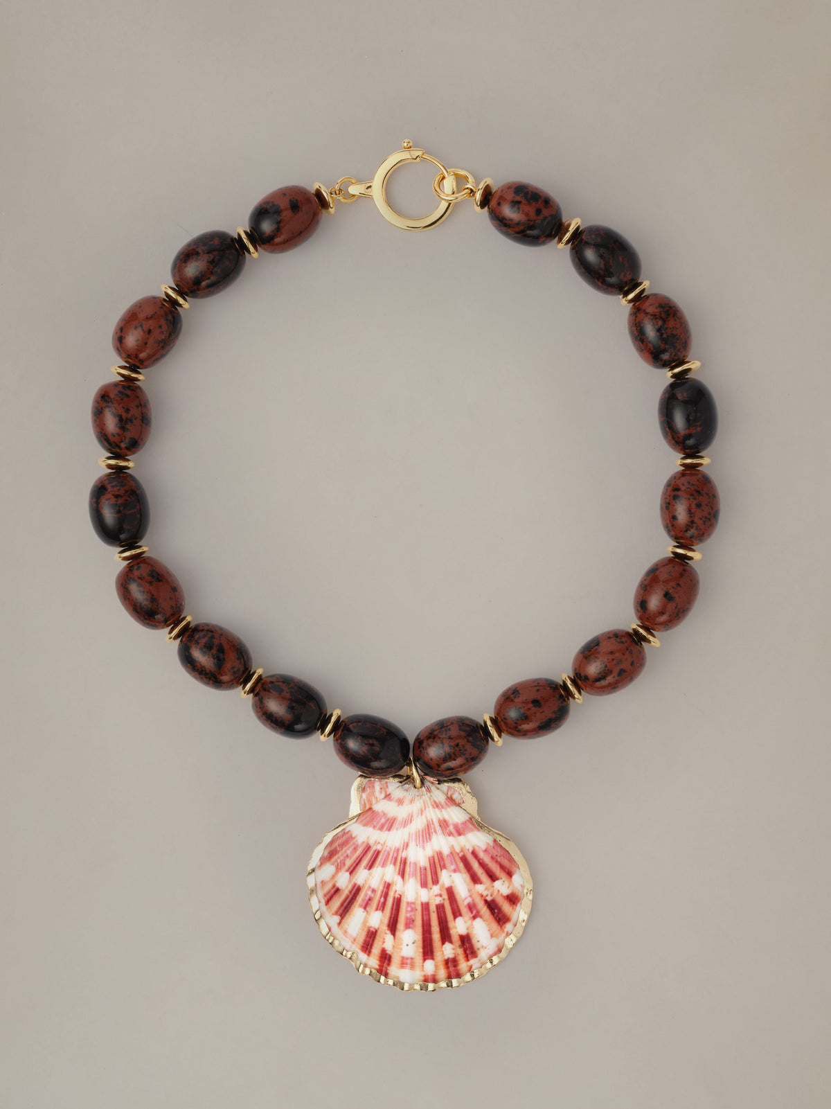 Shell Necklace by J.McLaughlin featuring dark red and black beads with a textured natural shell pendant and gold tone clasp