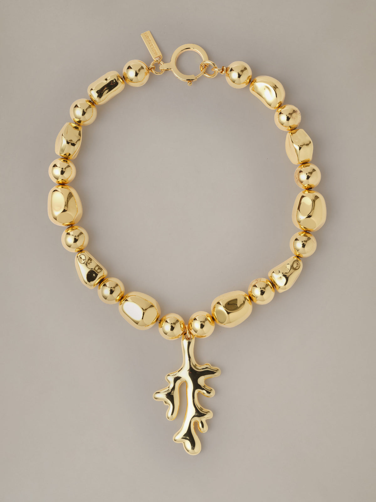 Coral Necklace by J.McLaughlin featuring a gold plated beaded chain and sculptural coral inspired pendant on a neutral background