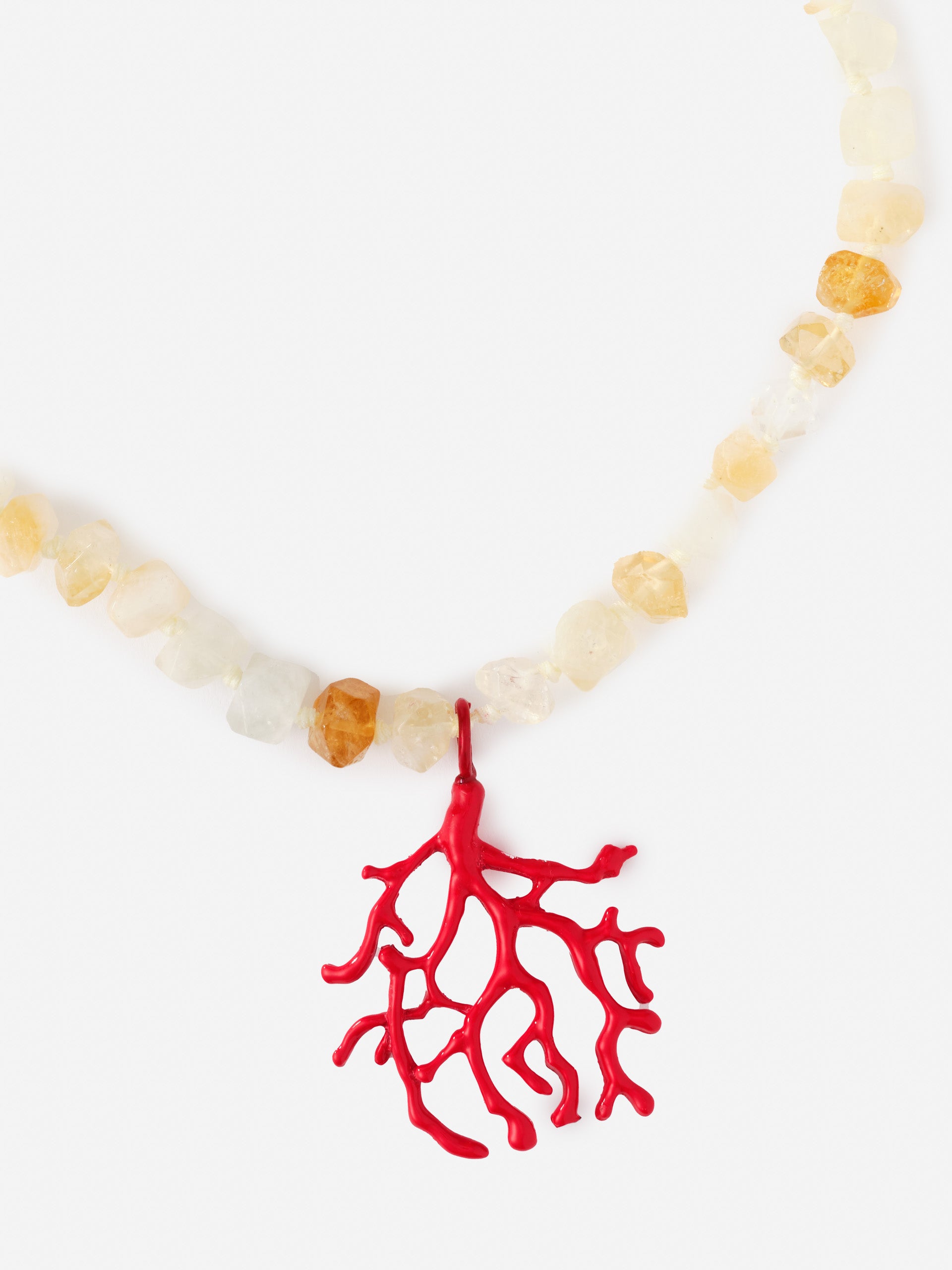 Coral Necklace featuring a red coral-shaped pendant on a strand of polished, earthy-toned stones, blending innovative fabrics with enduring designs by J.McLaughlin.