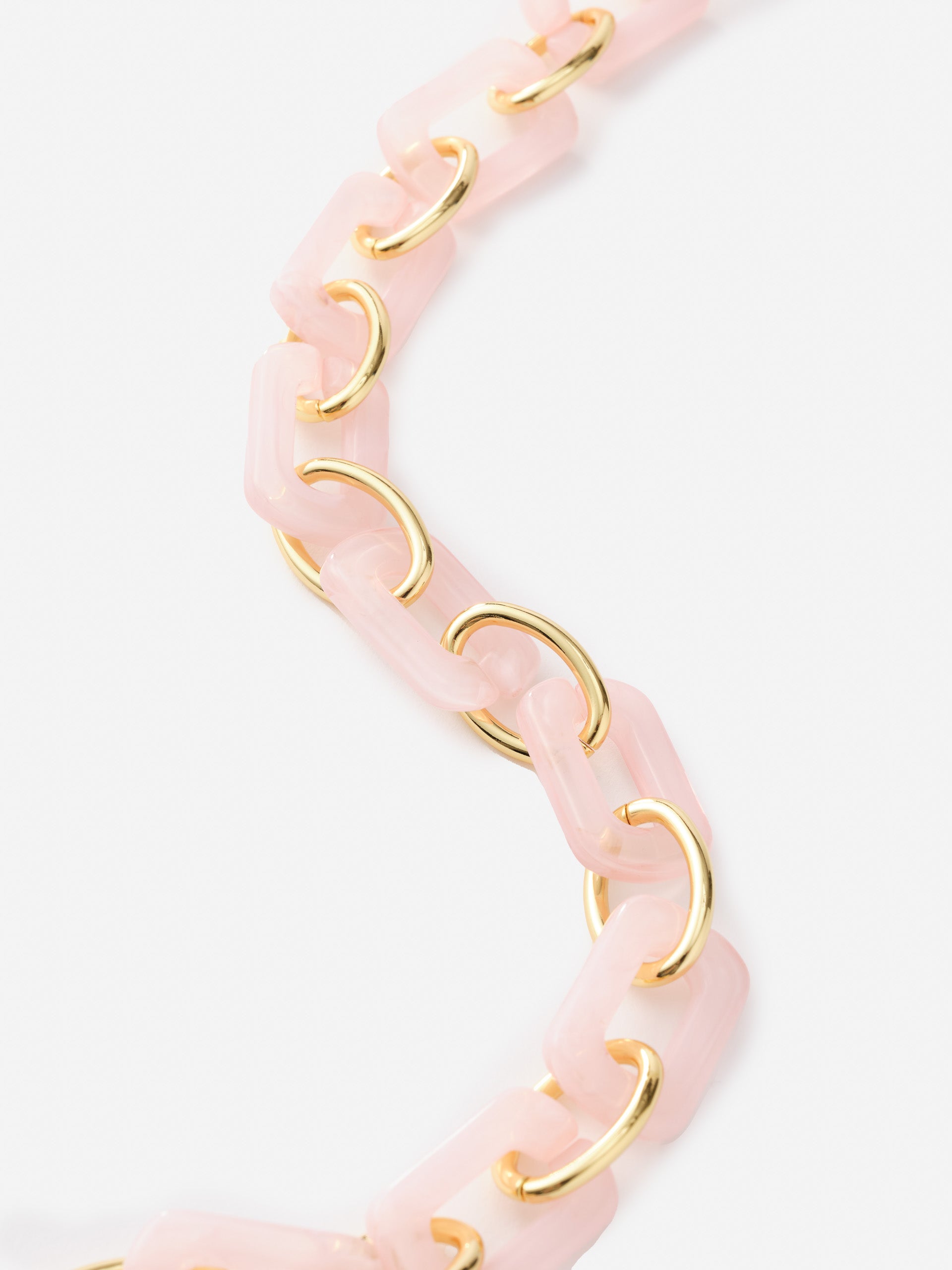 Close-up of a Chain Link Necklace by J.McLaughlin featuring soft pink rectangular links connected by gold rings, showcasing effortlessly stylish, enduring designs for a life well-lived.