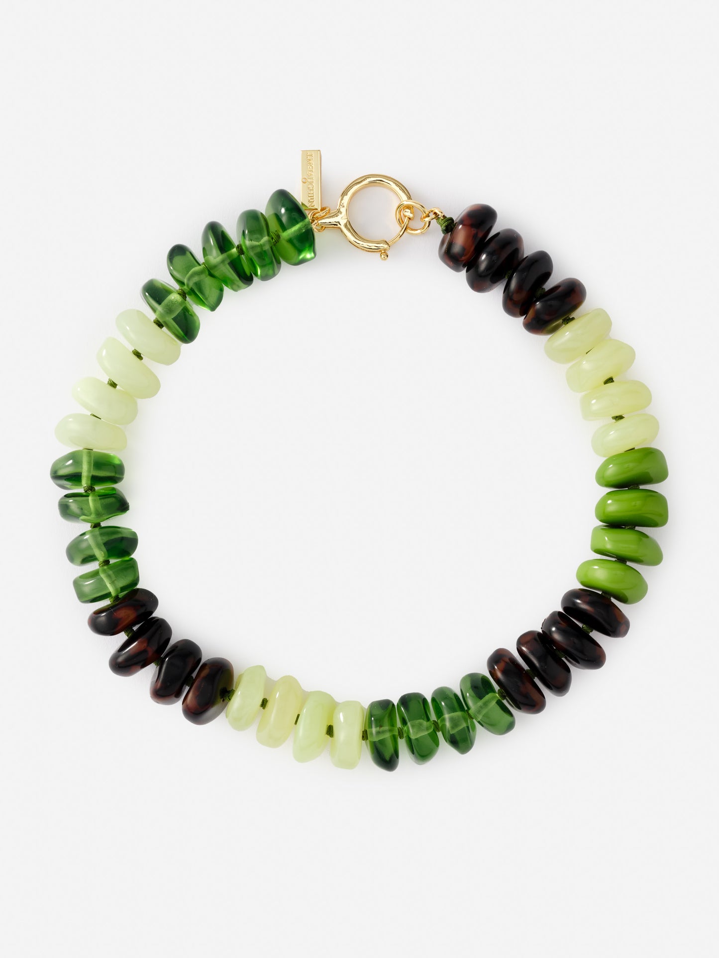 Tonal Bead Necklace by J.McLaughlin featuring a circle of polished green and dark beads with a gold clasp, effortlessly stylish and embodying enduring designs for a life well-lived.