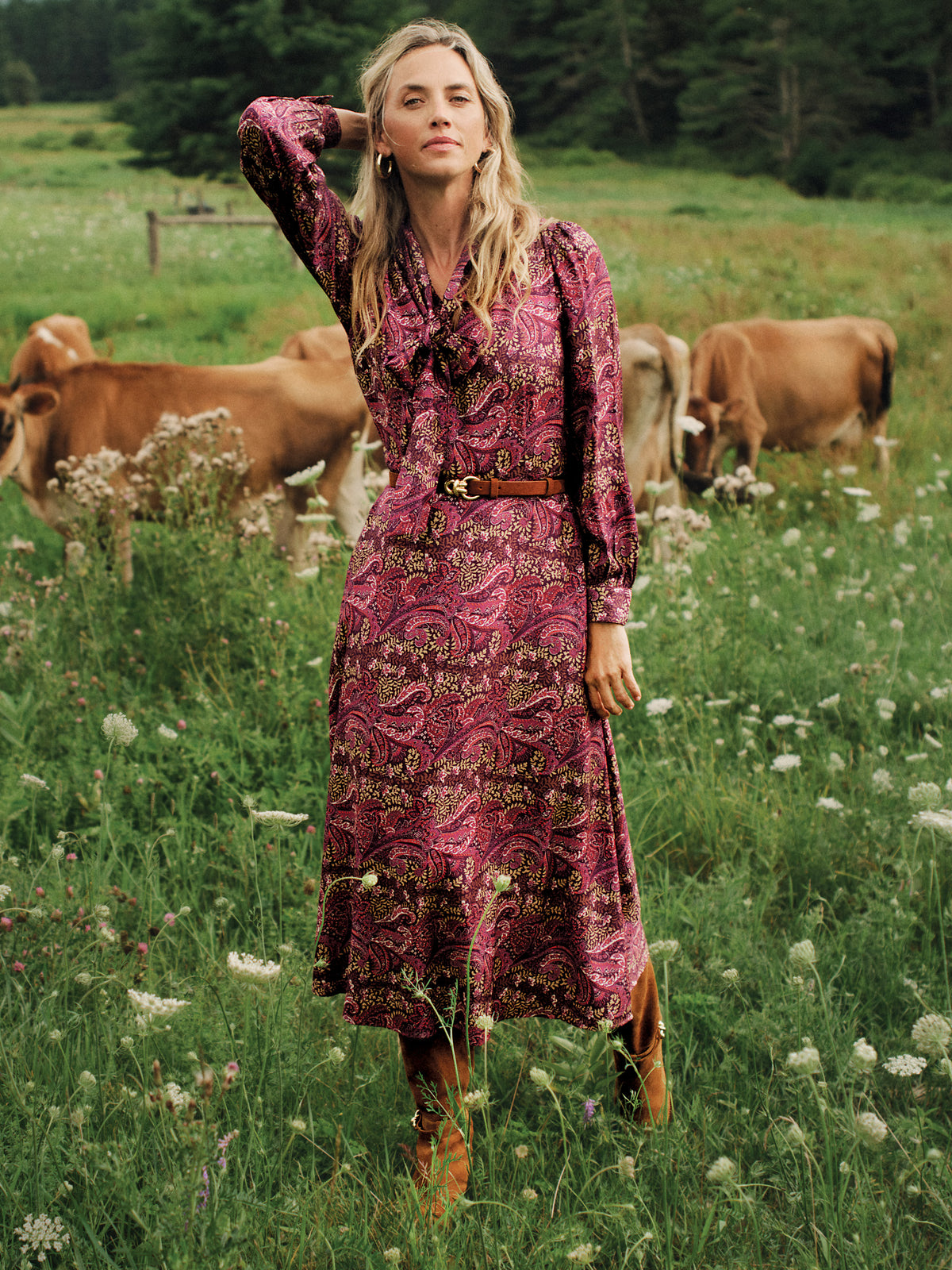 J.McLaughlin Cally Silk Blend Dress in Heritage Paisley worn with a belt by a woman in a flowering meadow