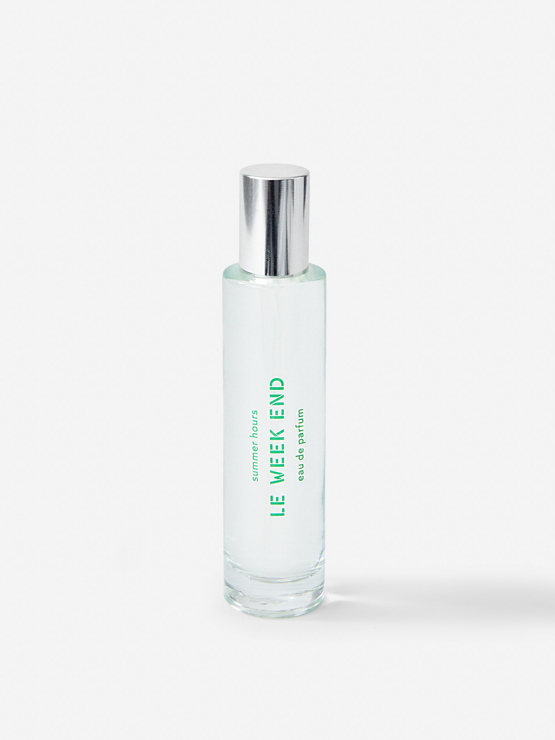 J.McL x Summer Hours Le Week End 50 mL Fragrance in green made with alcohol and water.