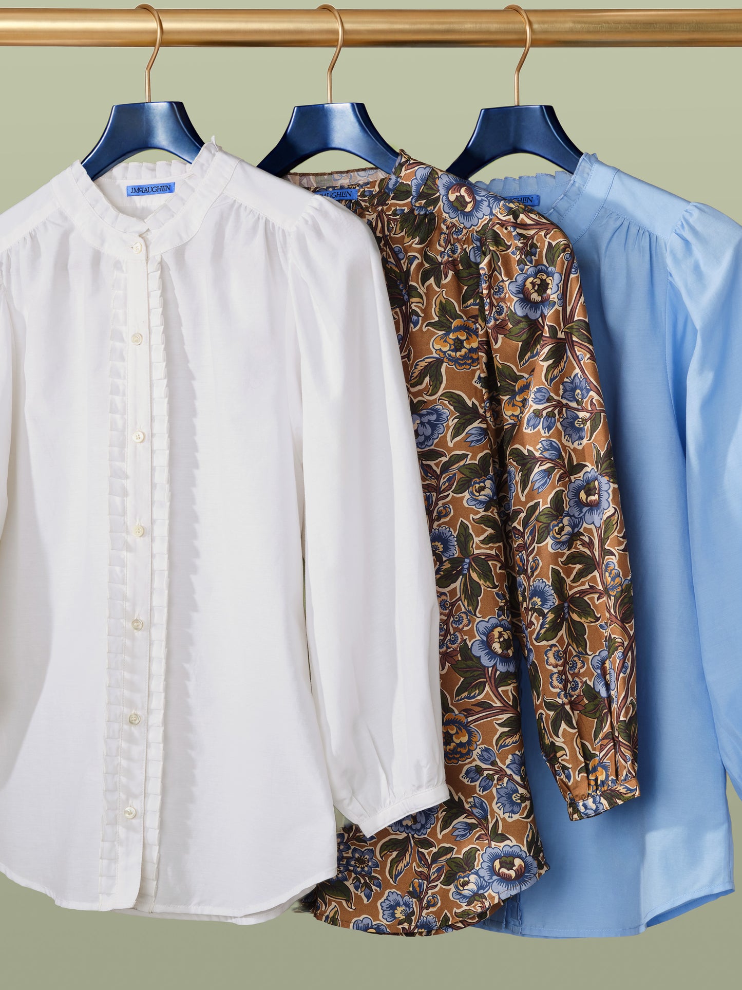 Three Josette Blouse in Bucolic Blooms by J.McLaughlin in white, floral pattern, and light blue, showcasing effortlessly stylish design and enduring quality.