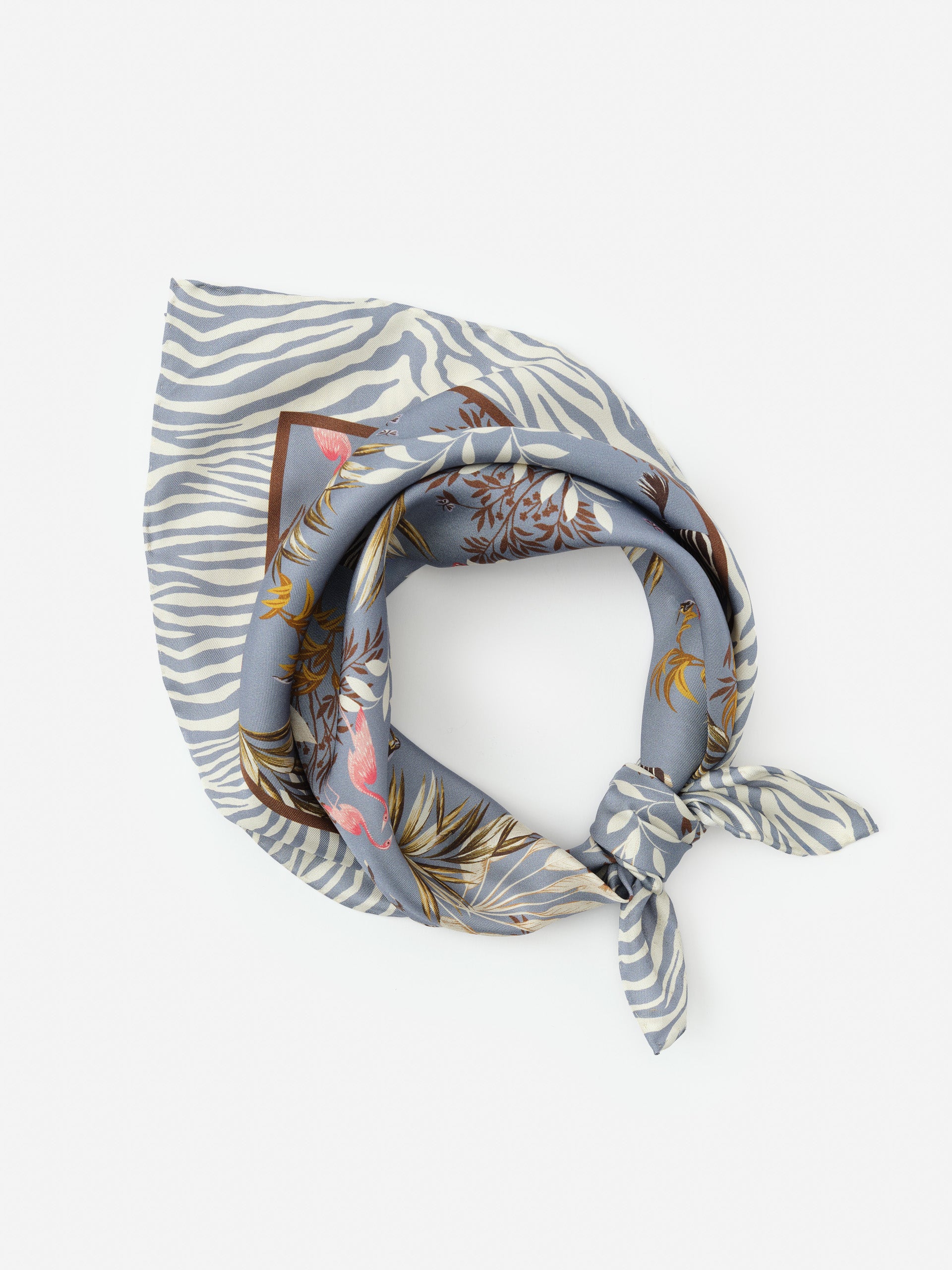 Nikka Silk Scarf in Zebra Story Court by J.McLaughlin showcasing innovative fabrics and enduring designs, effortlessly stylish for a legacy of timeless fashion – A destination for defining style. Life, Well-Lived.