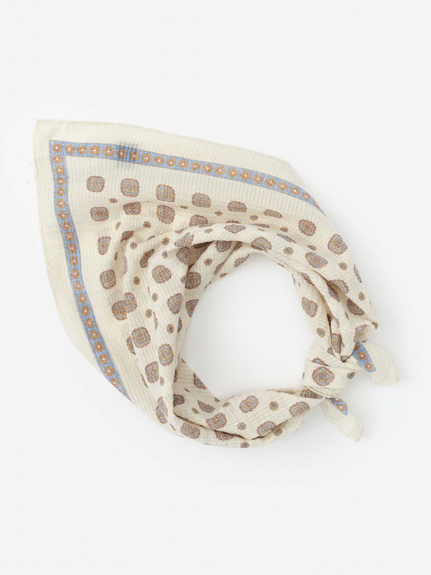 Light cream Seersucker Bandana in Stratford Square by J.McLaughlin, featuring a subtle blue and brown geometric pattern with soft textured fabric perfect for stylish scarves.