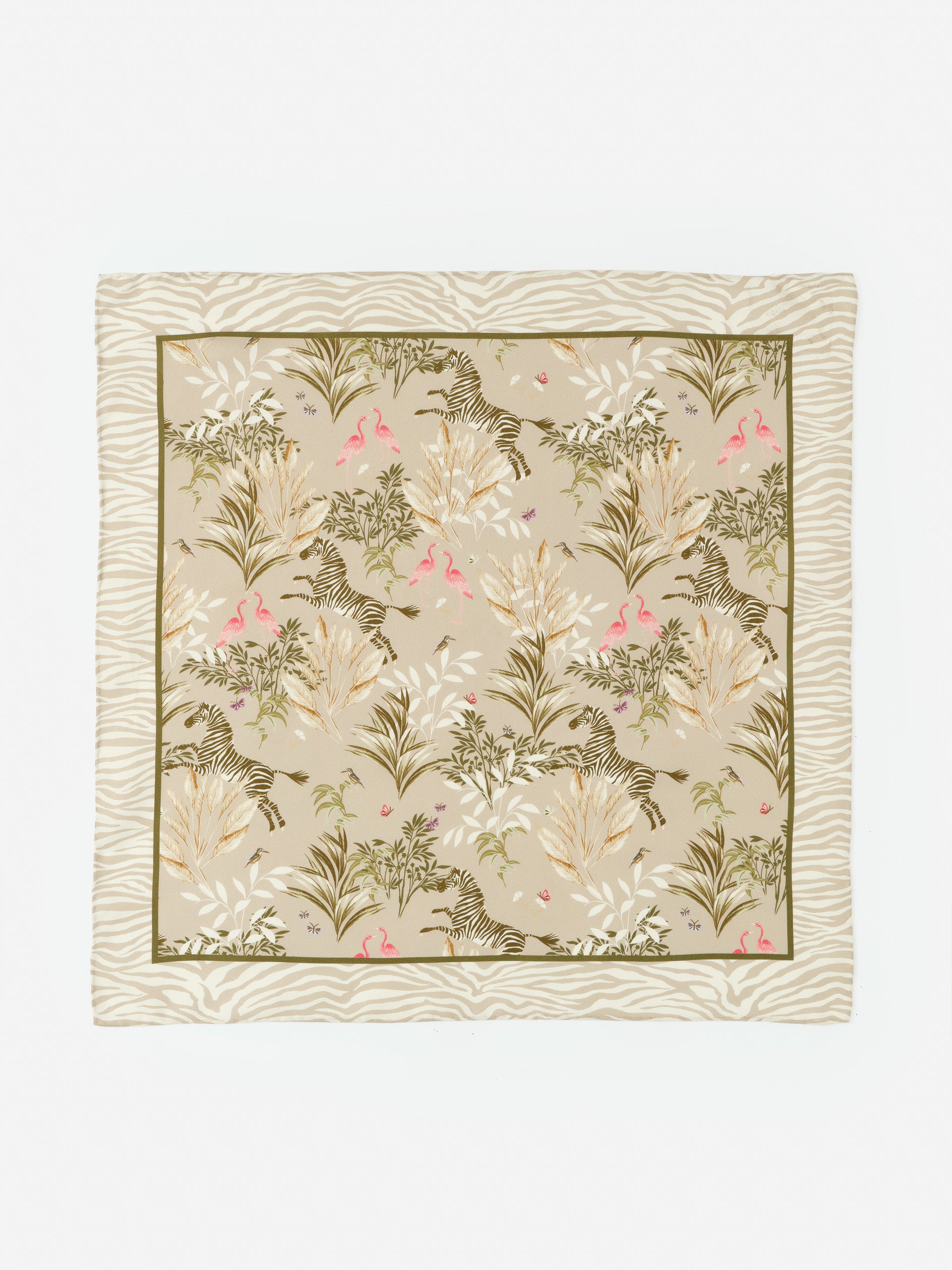 Nikka Silk Scarf in Zebra Story Court by J.McLaughlin features an effortlessly stylish design with zebra and flamingo motifs on a soft beige background, showcasing enduring designs and a legacy of timeless fashion. A destination for defining style. Life, Well-Lived.