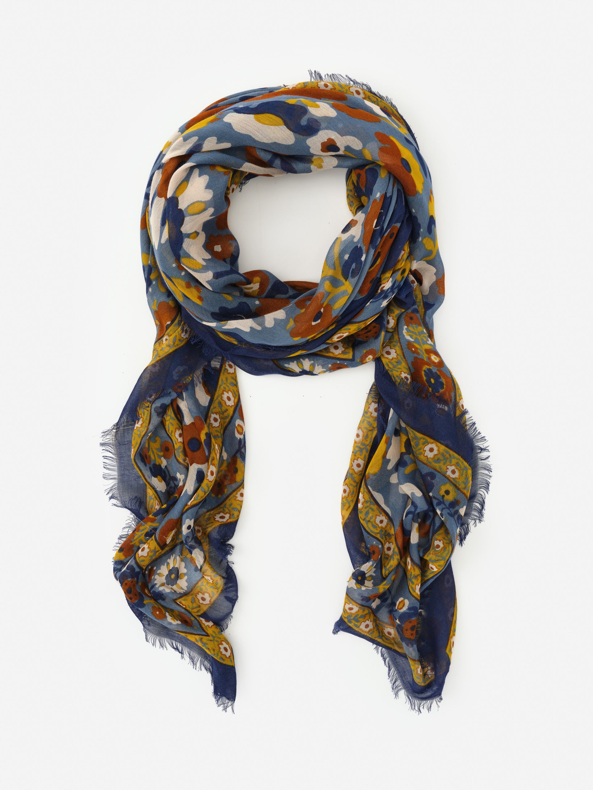 Lightweight scarf featuring a floral and geometric pattern in blue, orange, and yellow tones, exemplifying J.McLaughlin’s Giselle Scarf in Floral Daydream Border, effortlessly stylish with enduring designs and innovative fabrics, a destination for defining style. Life, Well-Lived.