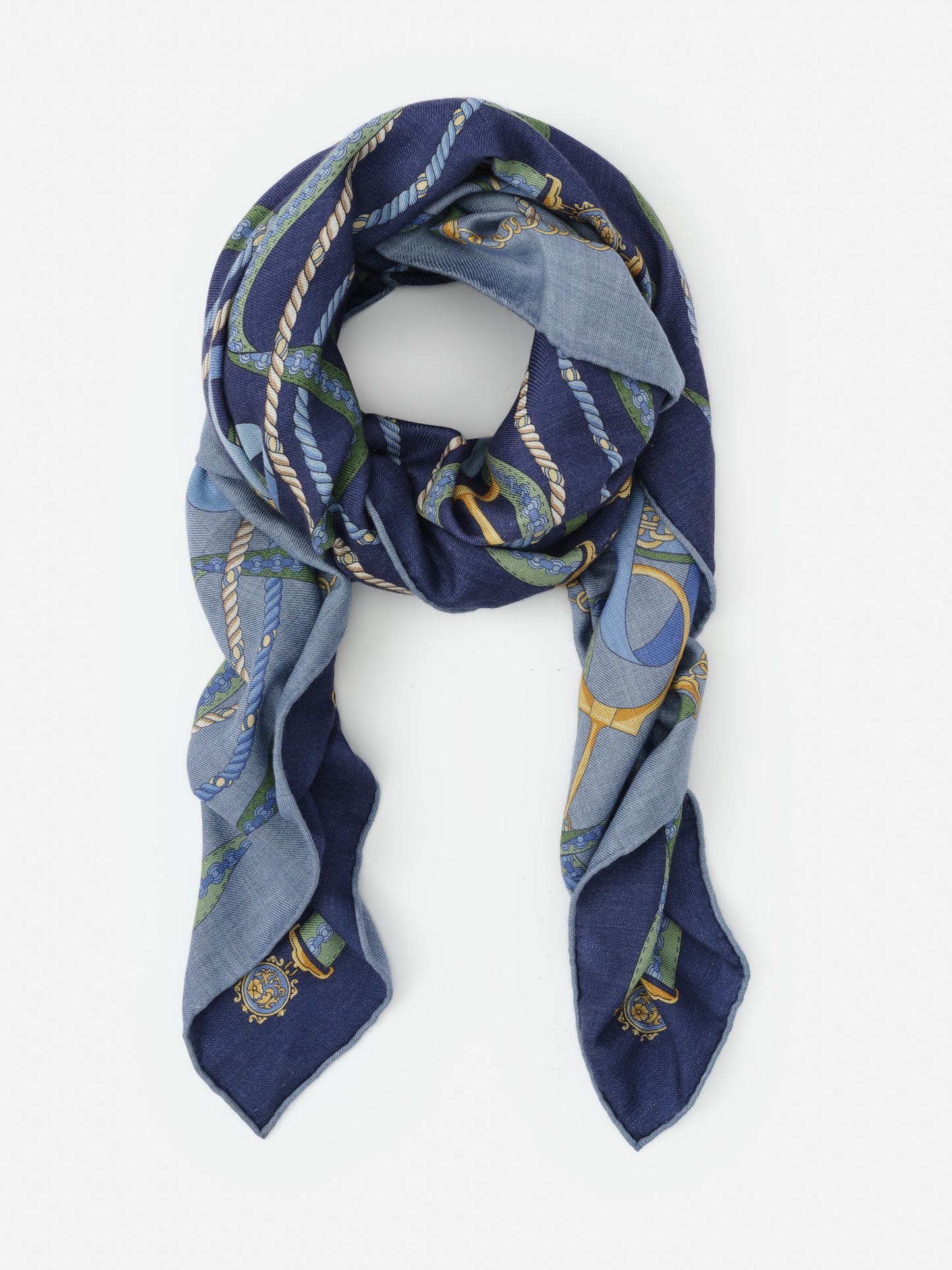 Vanessa Scarf in Nouveau Middleburg Border by J.McLaughlin features a thoughtfully designed, effortlessly stylish scarf in blue tones with intricate rope and chain patterns, blending innovative fabrics and enduring designs for a legacy of timeless fashion. A destination for defining style. Life, Well-Lived.