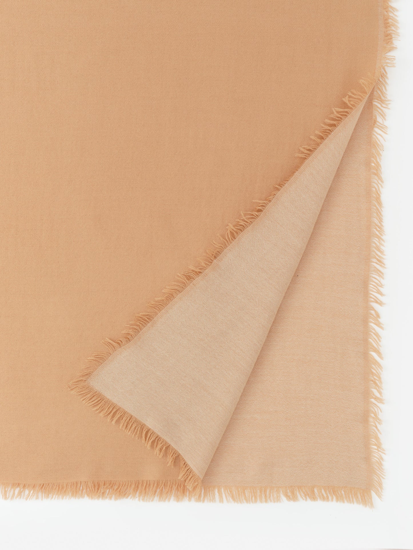 Carey Cashmere Scarf by J.McLaughlin in a soft tan shade with delicate fringed edges, combining effortlessly stylish appeal and enduring designs, a destination for defining style. Life, Well-Lived.