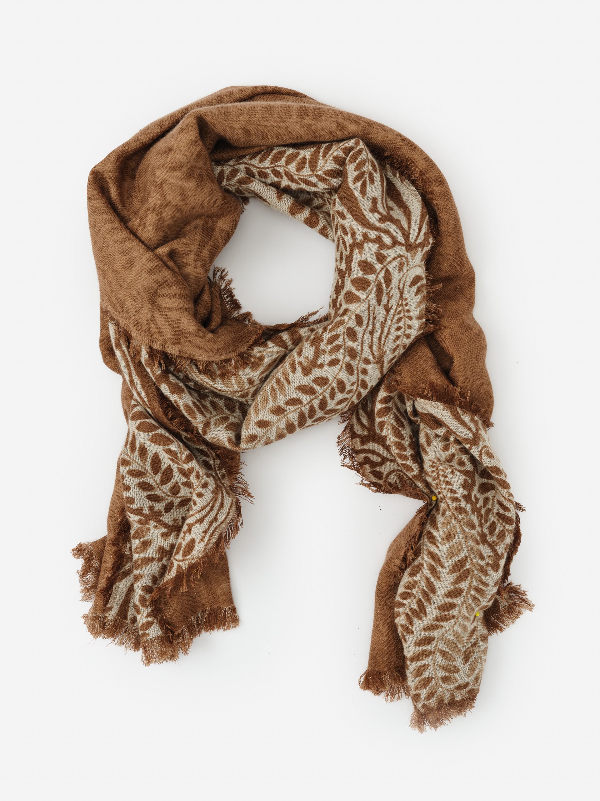 Carey Cashmere Scarf in Coral Current Shawl by J.McLaughlin, showcasing a soft, intricately patterned brown design with an effortlessly stylish feel, embodying enduring designs and a legacy of timeless fashion. A destination for defining style. Life, Well-Lived.