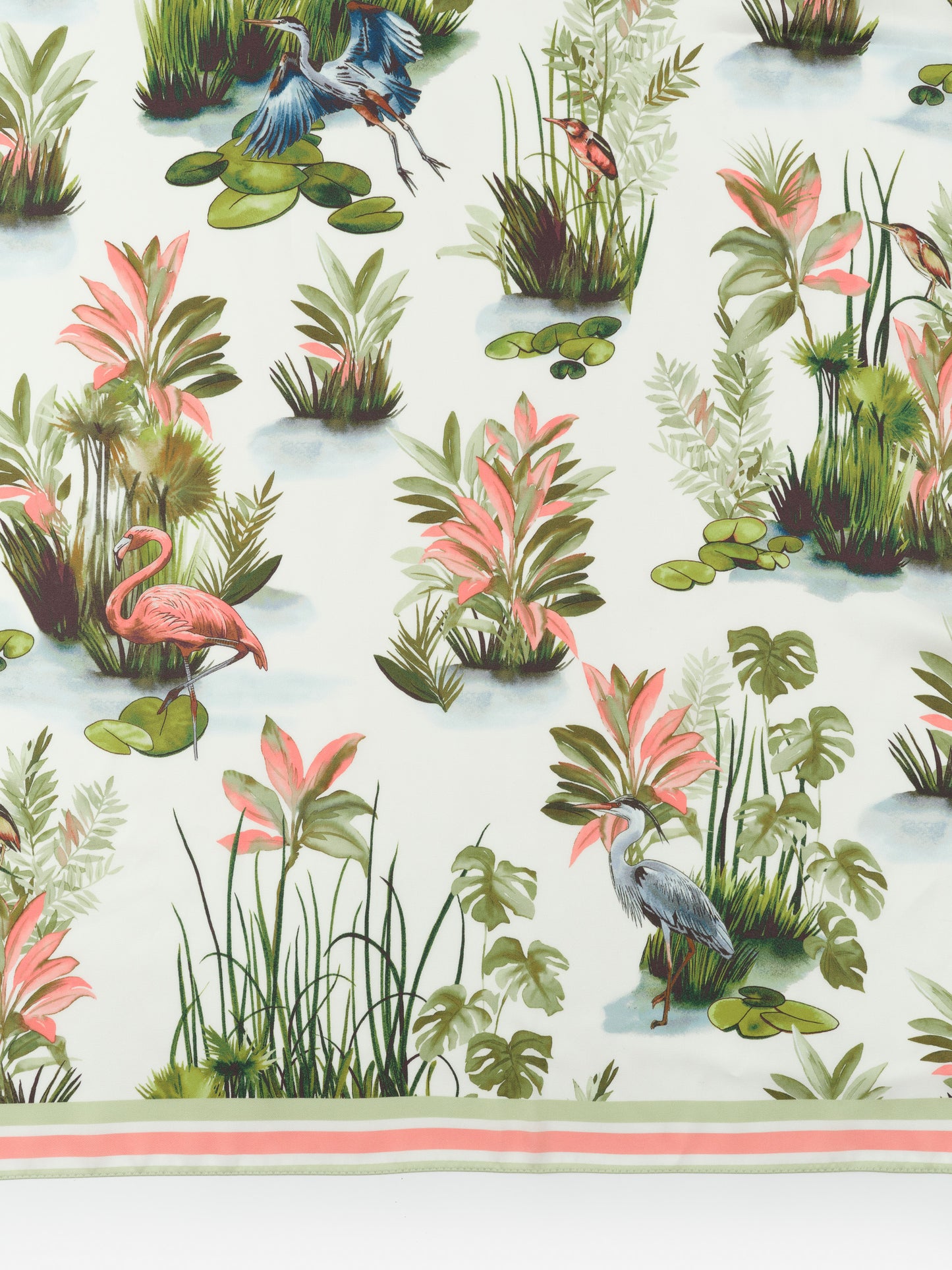 The Magic Scarf in Tidal Palms Border by J.McLaughlin features an effortlessly stylish print with tropical birds and plants, embodying enduring designs and a legacy of timeless fashion. A destination for defining style. Life, Well-Lived.