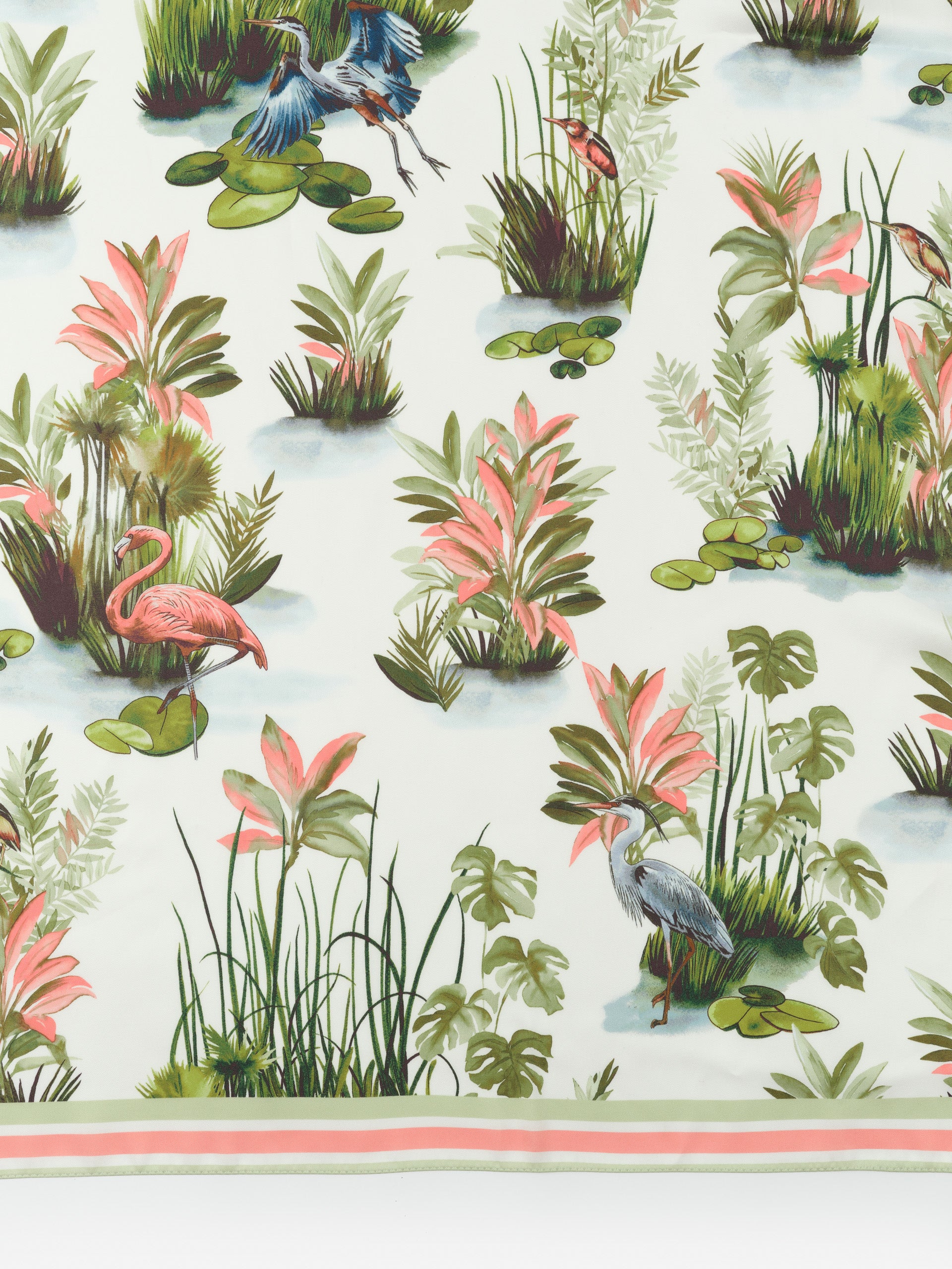 The Magic Scarf in Tidal Palms Border by J.McLaughlin features an effortlessly stylish print with tropical birds and plants, embodying enduring designs and a legacy of timeless fashion. A destination for defining style. Life, Well-Lived.