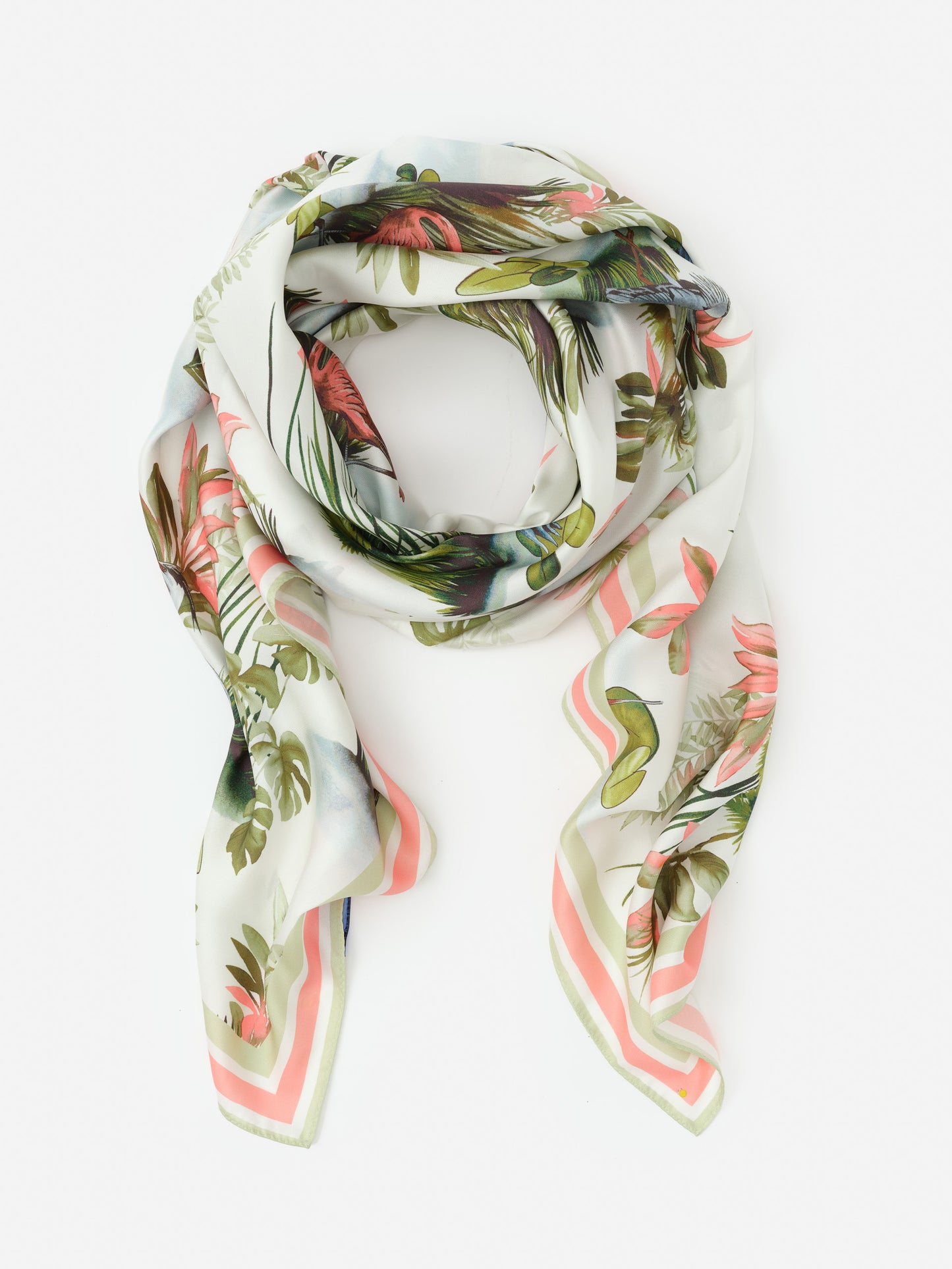 The Magic Scarf in Tidal Palms Border from J.McLaughlin features a softly draped tropical print with lush green leaves and coral accents, embodying effortlessly stylish, enduring designs with innovative fabrics—a destination for defining style. Life, Well-Lived.