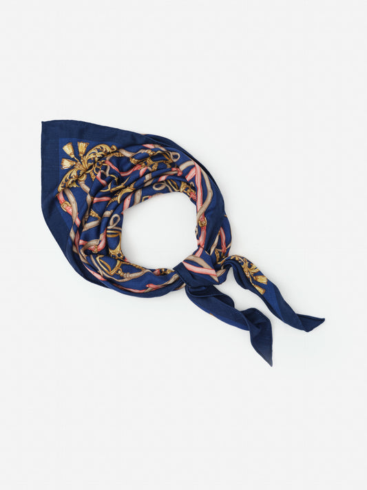 Sarita Scarf in Riding Lessons Corner by J.McLaughlin features a richly patterned navy scarf with elegant gold and pink accents, embodying effortlessly stylish, enduring designs and innovative fabrics. A destination for defining style. Life, Well-Lived.