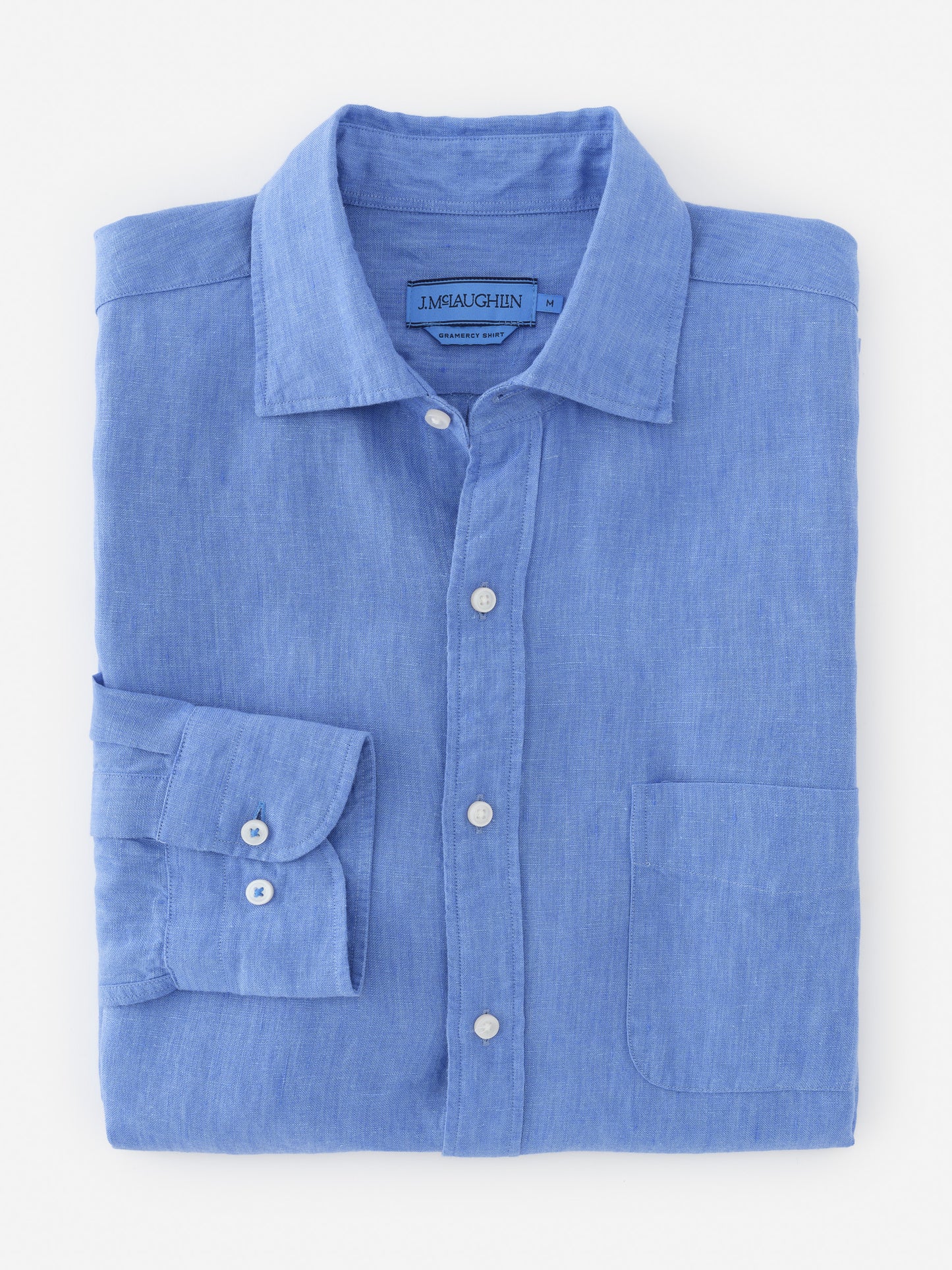 Folded Gramercy Linen Shirt in soft blue from J.McLaughlin, showcasing effortlessly stylish design and innovative fabrics for enduring appeal, a destination for defining style. Life, Well-Lived.