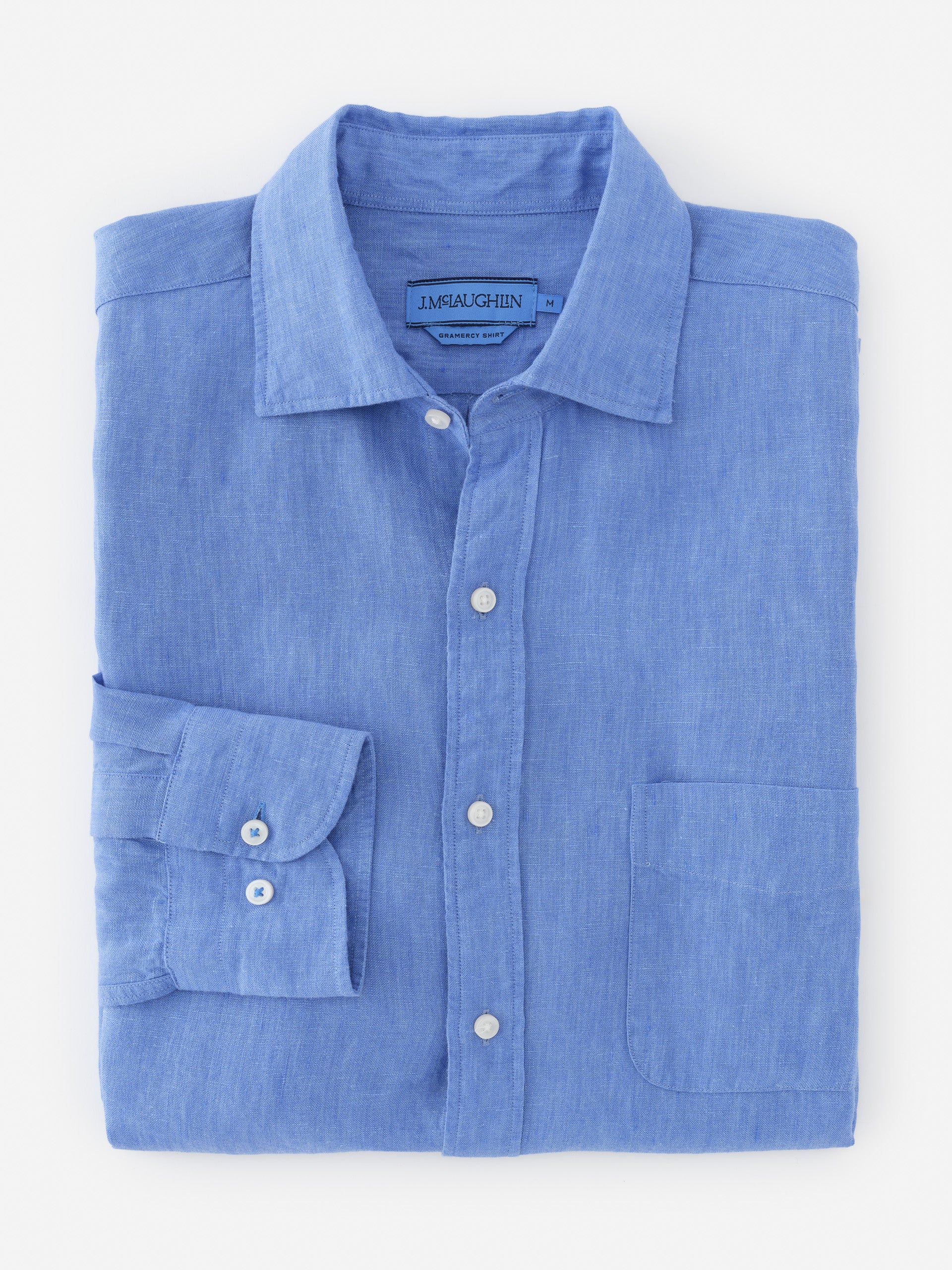 Folded Gramercy Linen Shirt in soft blue from J.McLaughlin, showcasing effortlessly stylish design and innovative fabrics for enduring appeal, a destination for defining style. Life, Well-Lived.