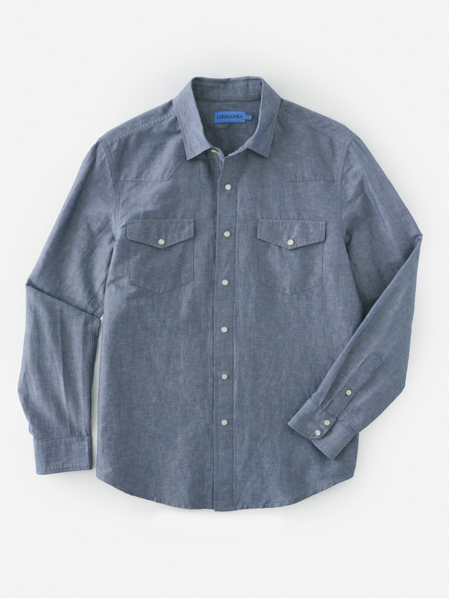 Tribeca Western Shirt by J.McLaughlin in a classic blue with button-down front and chest pockets, blending effortlessly stylish design and enduring craftsmanship for a legacy of timeless fashion. A destination for defining style. Life, Well-Lived.