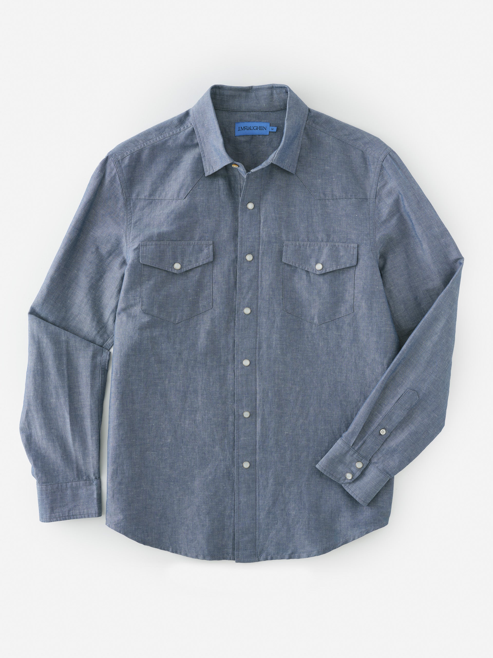 Tribeca Western Shirt by J.McLaughlin in a classic blue with button-down front and chest pockets, blending effortlessly stylish design and enduring craftsmanship for a legacy of timeless fashion. A destination for defining style. Life, Well-Lived.