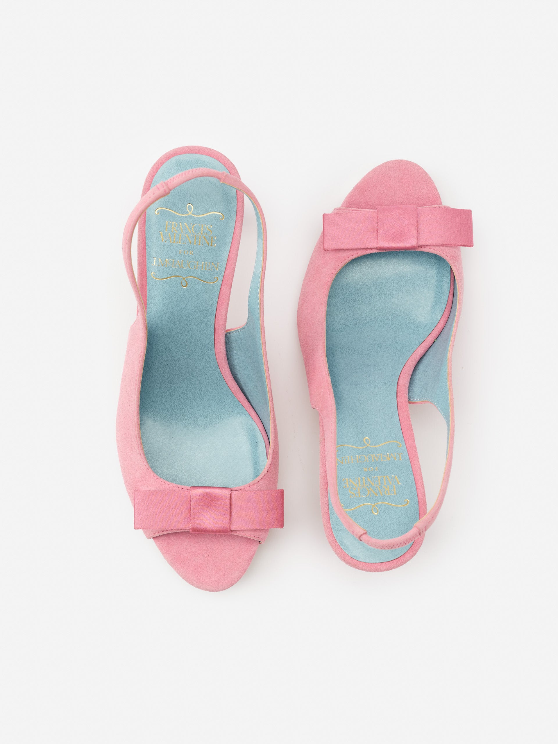 Reese Suede Slingbacks in soft pink featuring a bow detail and blue insoles, by J.McLaughlin, showcasing effortlessly stylish, enduring designs in timeless suede shoes.
