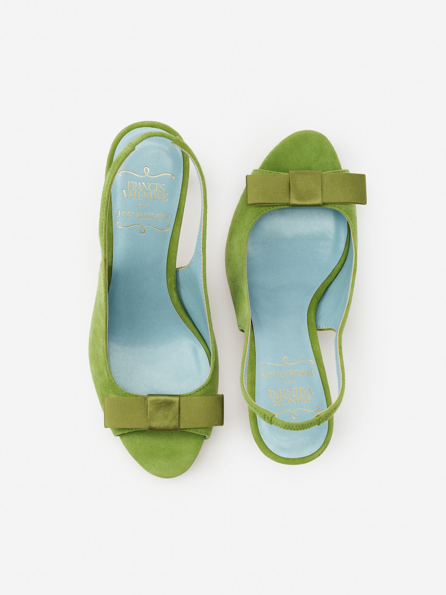 Reese Suede Slingbacks in vibrant green suede with elegant bow detail, showcasing J.McLaughlin’s effortlessly stylish, enduring designs and legacy of timeless fashion.