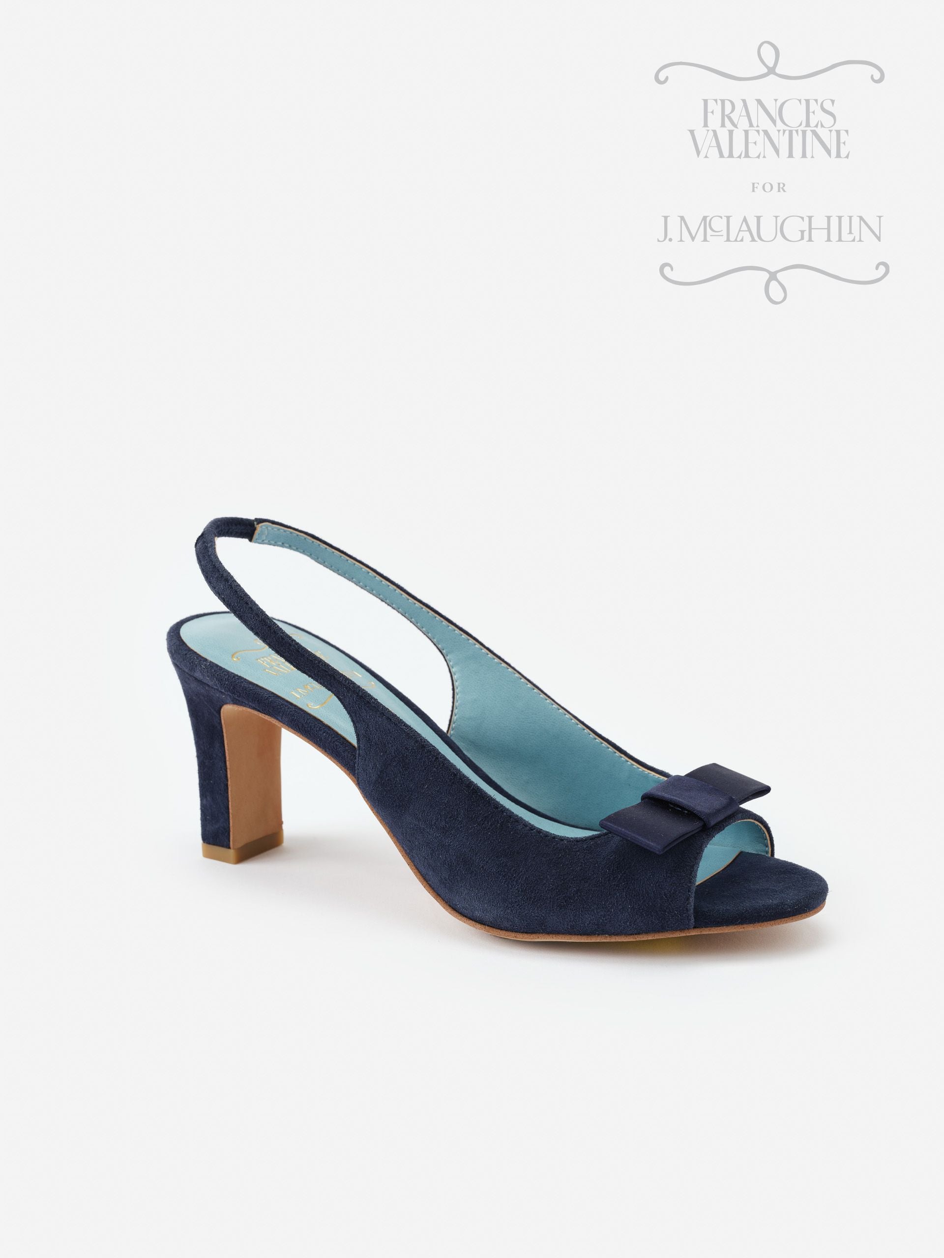 Reese Suede Slingbacks in navy by J.McLaughlin feature a classic open-toe design with a mid heel and bow detail, blending enduring designs and impeccable craftsmanship for effortlessly stylish looks.