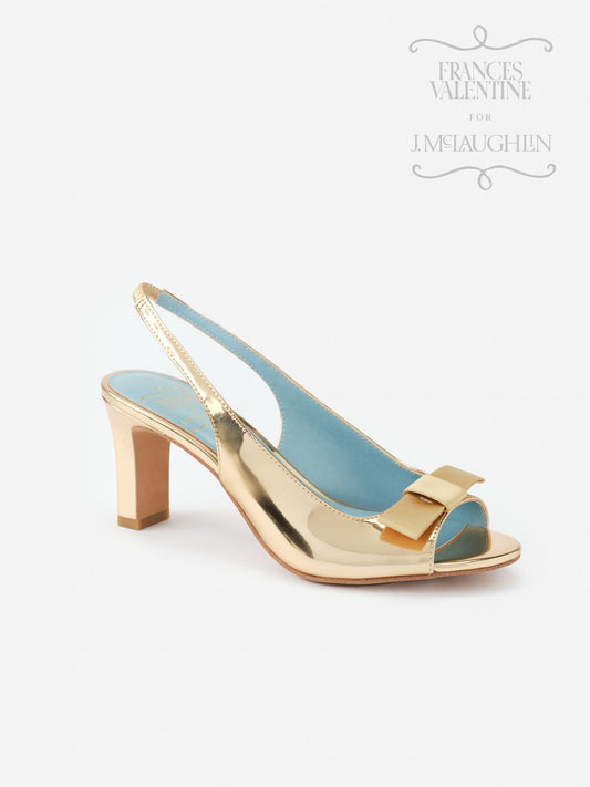 Reese Slingbacks by J.McLaughlin feature an effortlessly stylish gold metallic finish with a classic slingback silhouette and bow accent, showcasing enduring designs and timeless fashion.