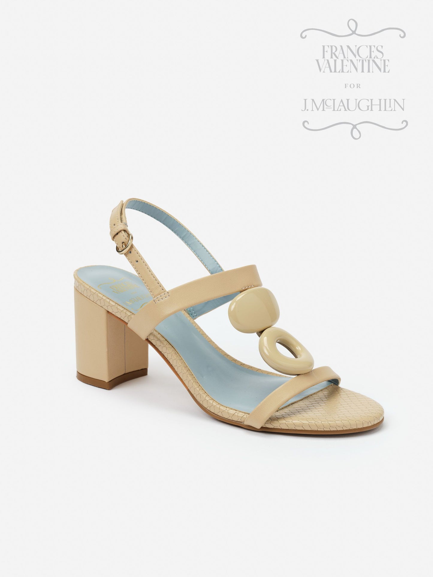 Beige Bianca Heels by J.McLaughlin featuring a block heel, slingback strap, and decorative circular accents, combining effortlessly stylish design with enduring appeal.