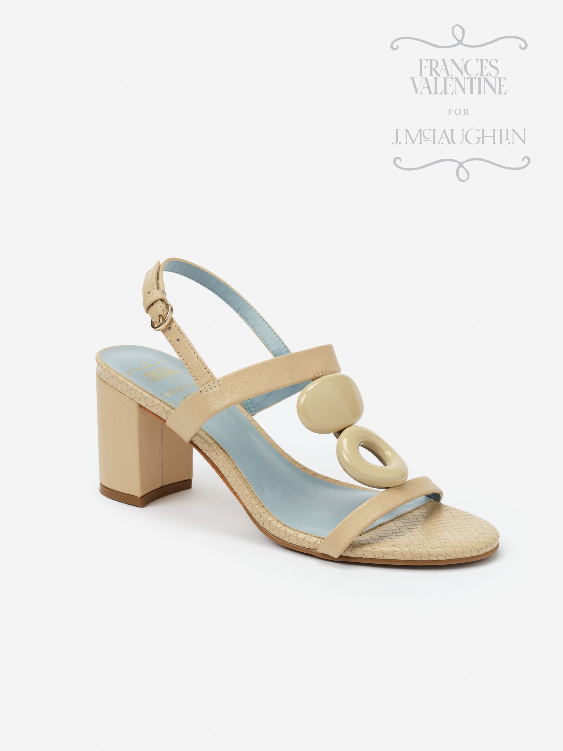Beige Bianca Heels by J.McLaughlin featuring a block heel, slingback strap, and decorative circular accents, combining effortlessly stylish design with enduring appeal.