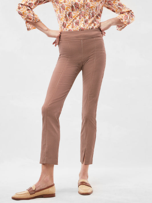 Model wears J.McLaughlin Jaydan pants in brown/cream made with Amelia Cloth.