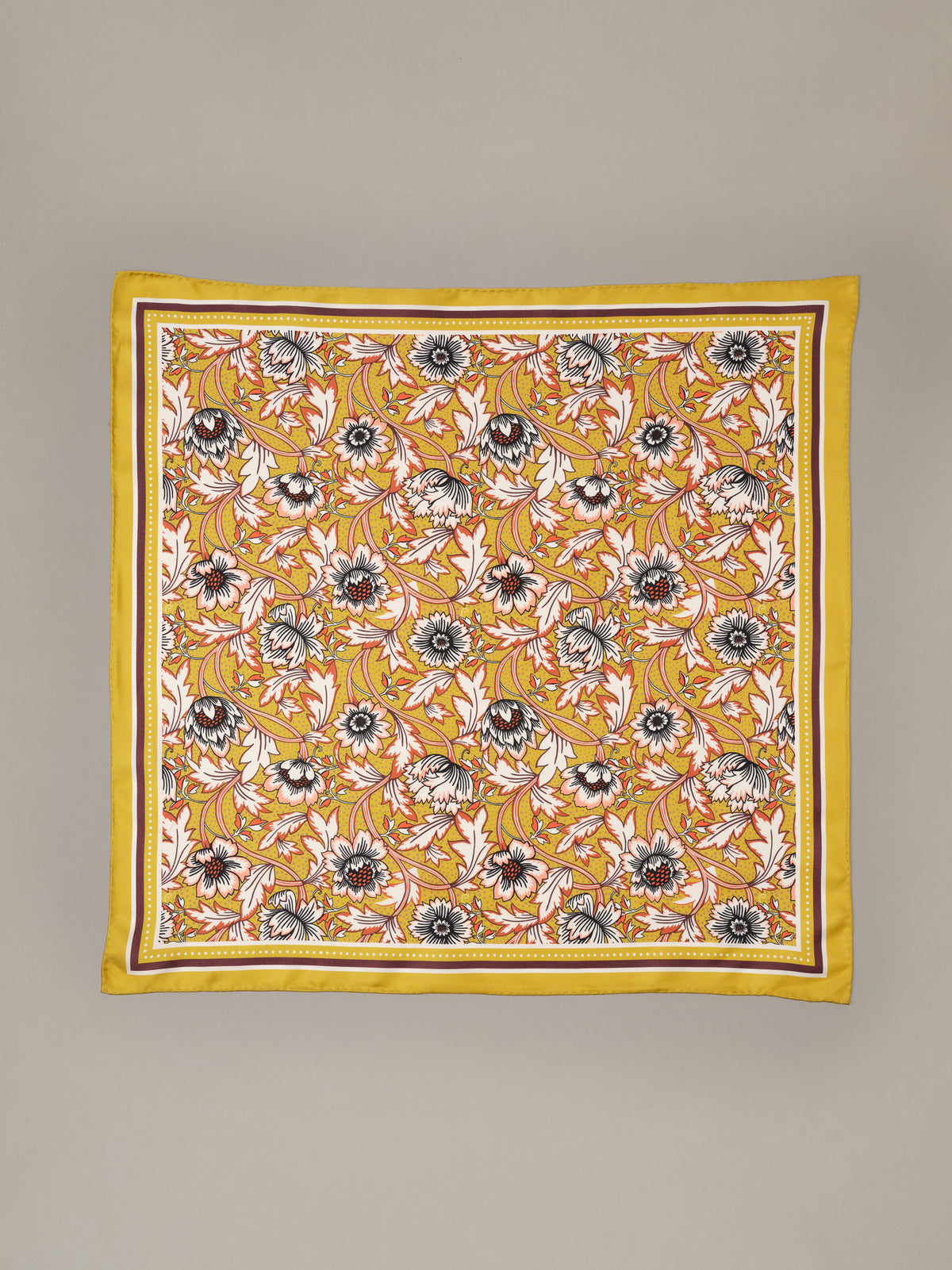 The Eloise Silk Scarf in Belle Epoque Bloom by J.McLaughlin featuring a vibrant yellow floral print with a decorative border crafted from luxurious silk
