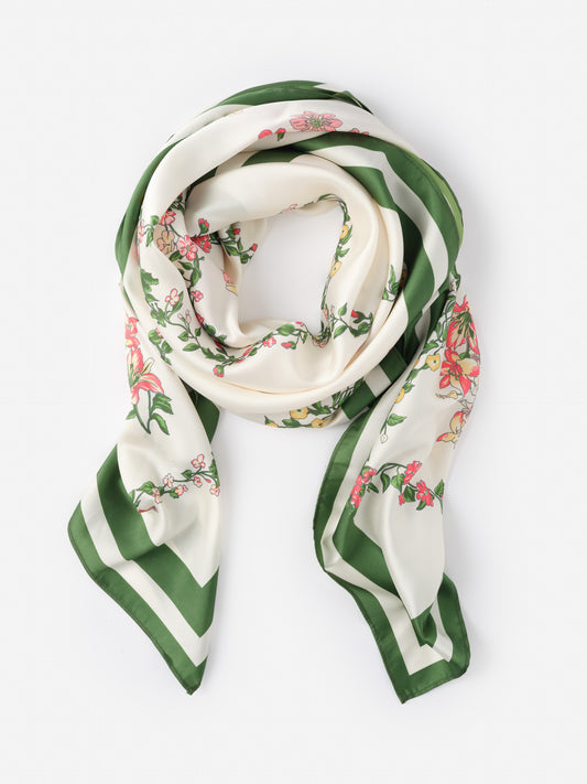 The Magic Scarf in Floral Medley Frame Border by J.McLaughlin showcases effortlessly stylish, enduring designs with a green and cream floral pattern, perfect for a destination defining style. Life, Well-Lived.