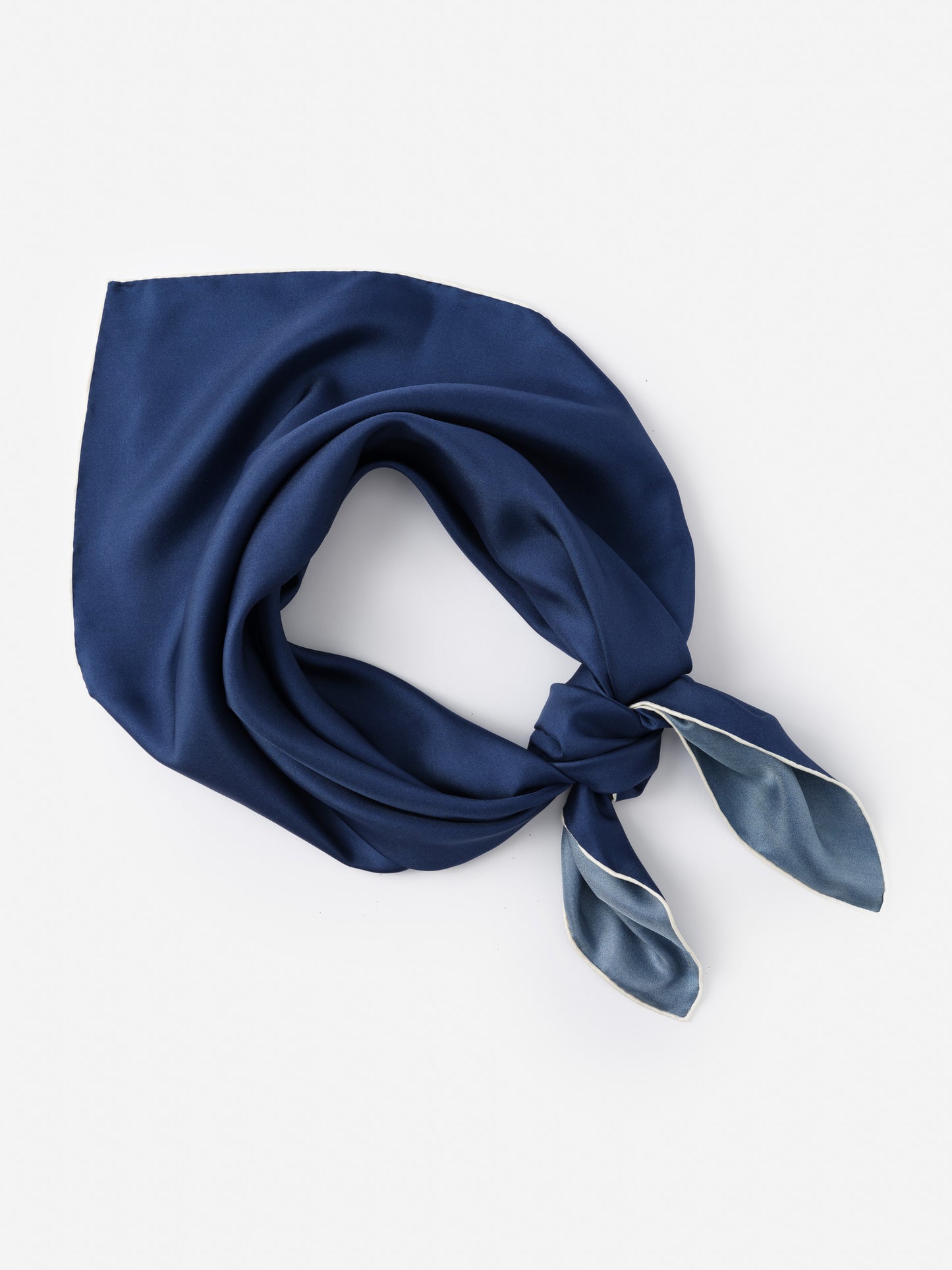 Kyleigh Silk Scarf in rich navy blue by J.McLaughlin, showcasing effortlessly stylish design and innovative fabrics for enduring elegance, a destination for defining style. Life, Well-Lived.