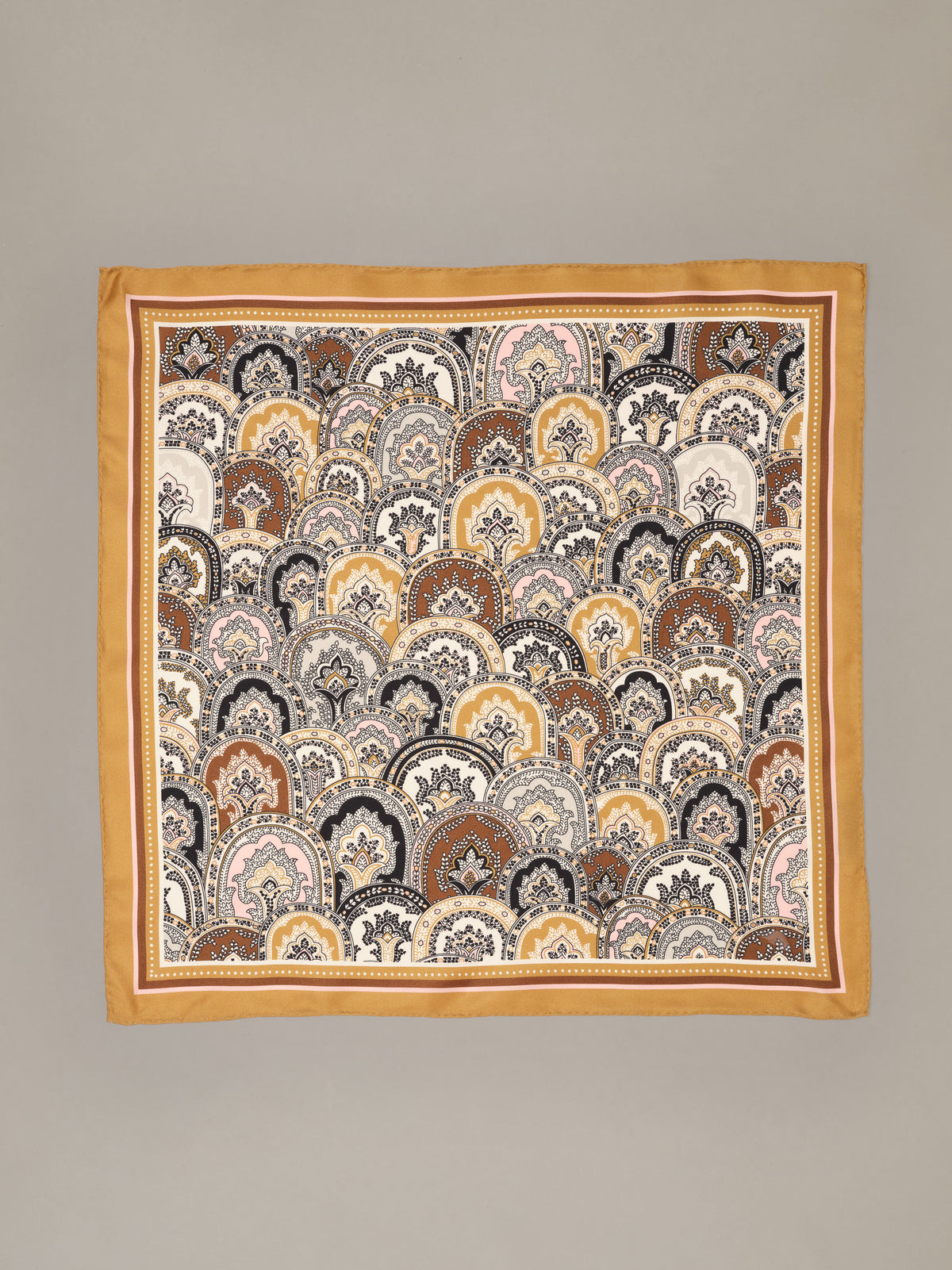 The Eloise Silk Scarf in Far Paisley by J.McLaughlin featuring an ornate paisley print in gold brown cream and black on luxurious silk