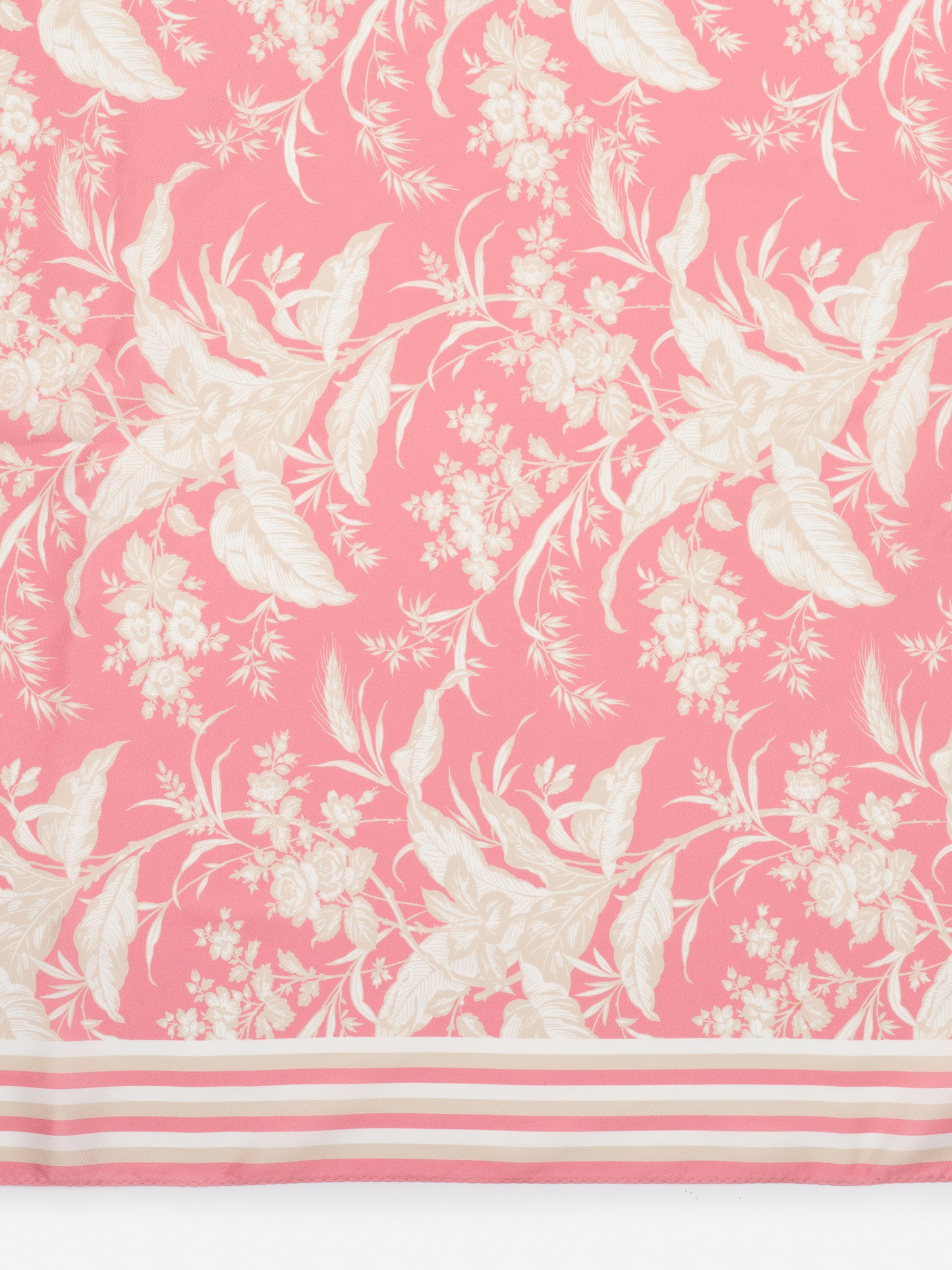 The Magic Scarf in Giardino Toile Border by J.McLaughlin features a delicate floral pattern in soft cream tones on a pink background, embodying effortlessly stylish, enduring designs. A destination for defining style. Life, Well-Lived.