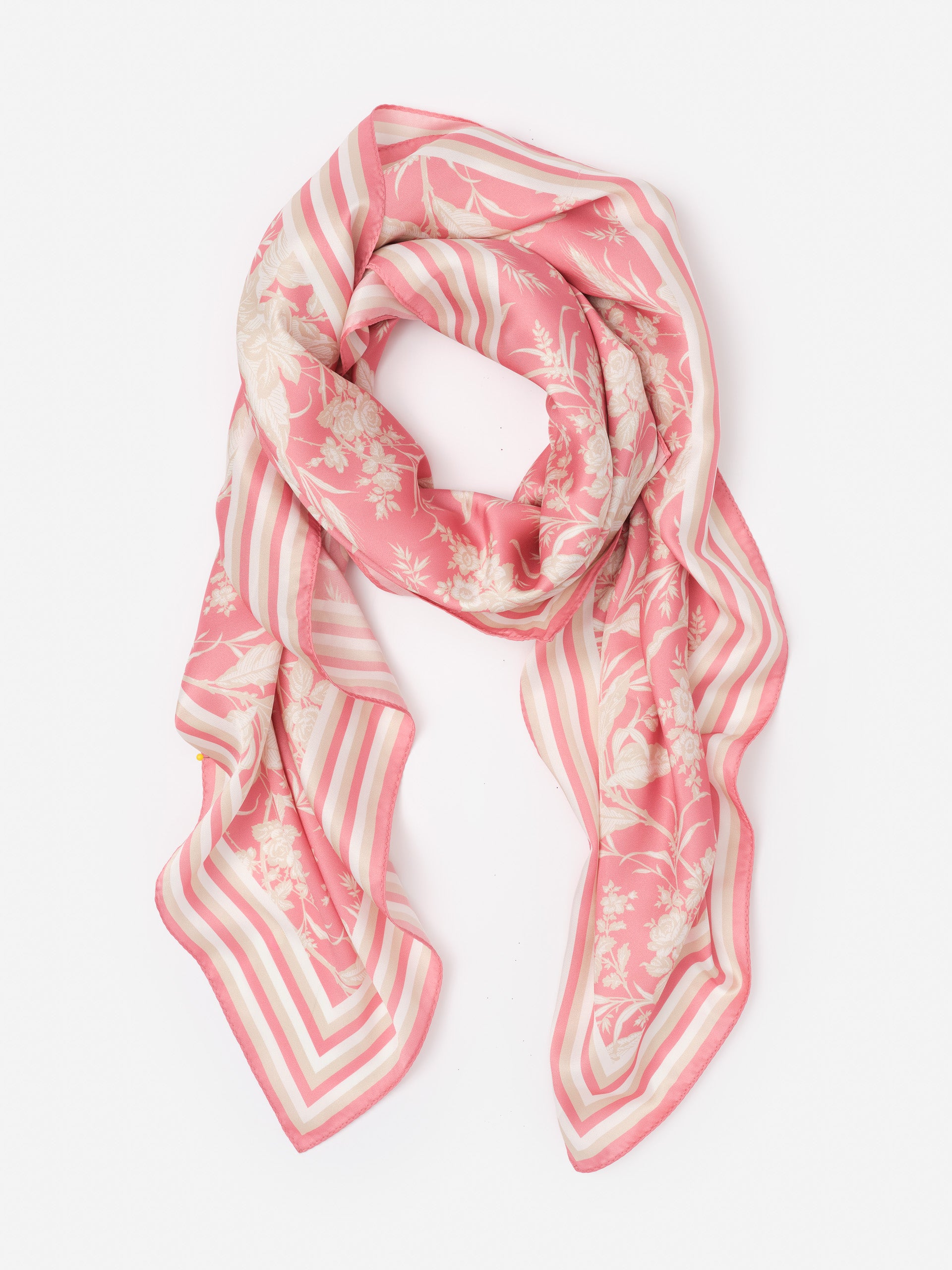 The Magic Scarf in Giardino Toile Border by J.McLaughlin showcases effortlessly stylish, enduring designs with a pink floral and striped pattern, embodying a legacy of timeless fashion. A destination for defining style. Life, Well-Lived.