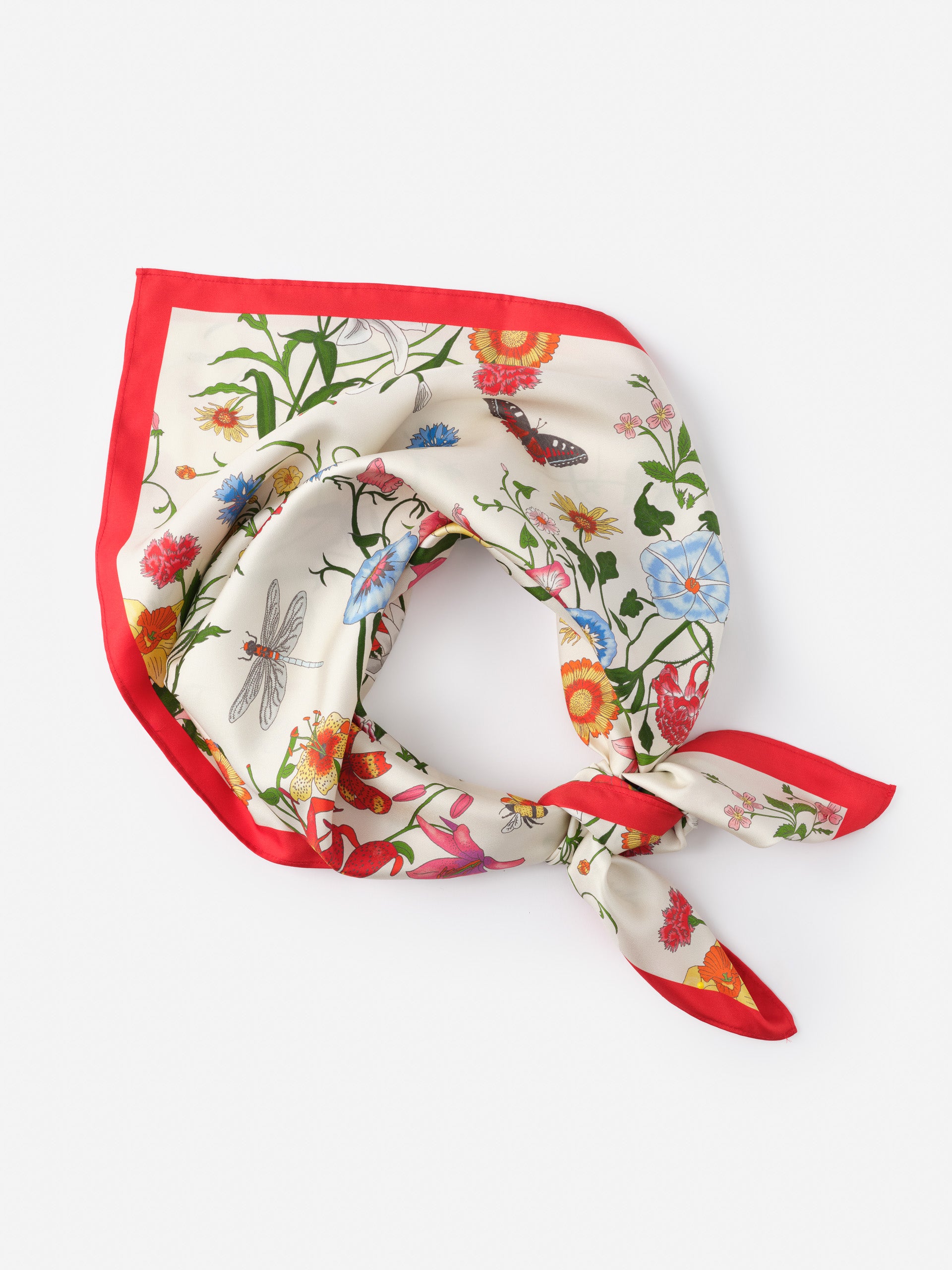 Kyleigh Silk Scarf in Dragonfly Garden by J.McLaughlin features a vibrant floral and insect print with a red border, blending effortlessly stylish design and innovative fabrics for enduring fashion.