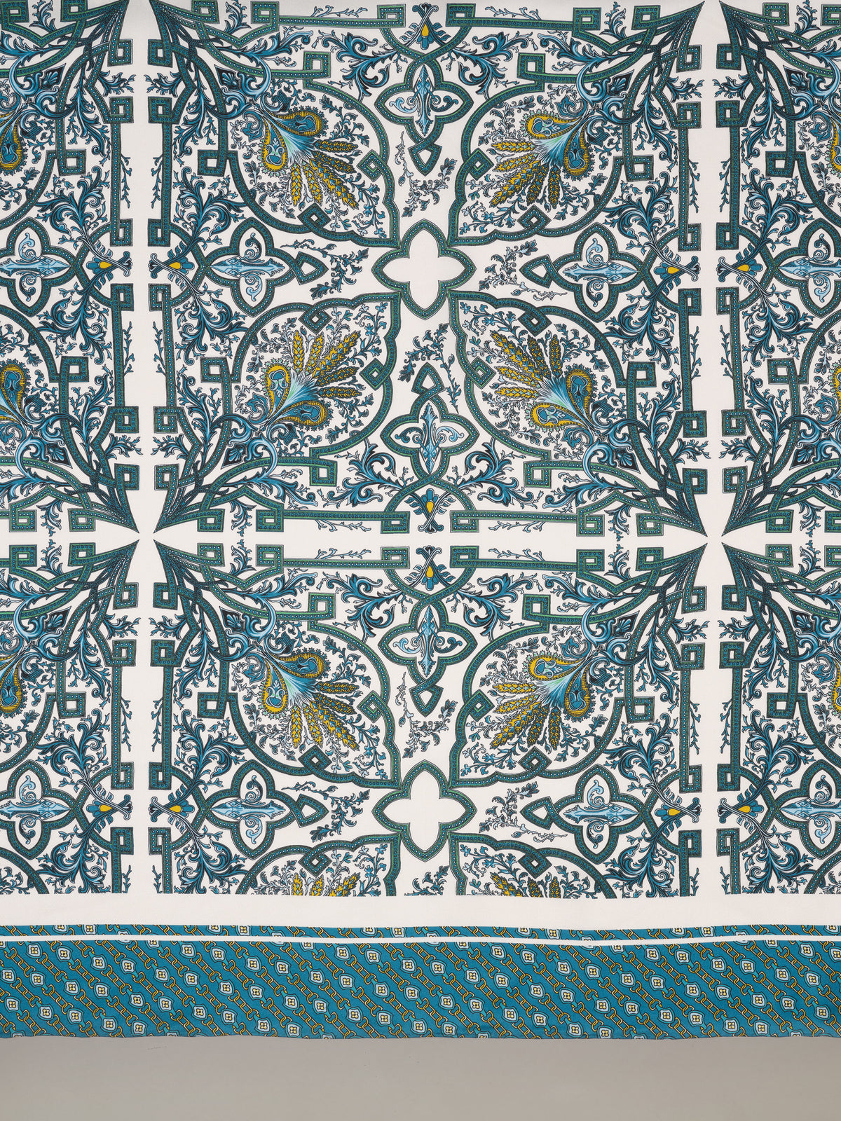The Grace Silk Scarf in Baroque Medallion Square by J.McLaughlin featuring an ornate blue teal and gold medallion pattern on silk with hand rolled edges