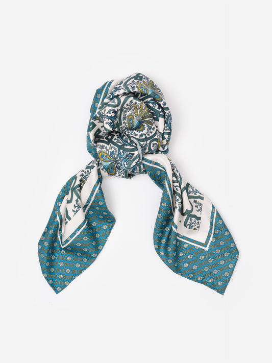 The Grace Silk Scarf in Baroque Medallion Square by J.McLaughlin features a timeless baroque pattern in teal and white with gold accents, crafted from 100% silk for an effortlessly stylish accessory.