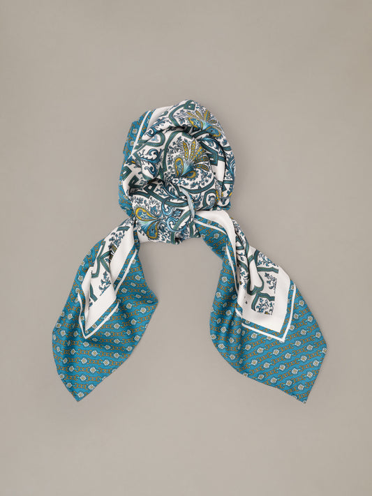 The Grace Silk Scarf in Baroque Medallion Square by J.McLaughlin blue and white silk scarf with ornate baroque medallion pattern styled in a loose knot