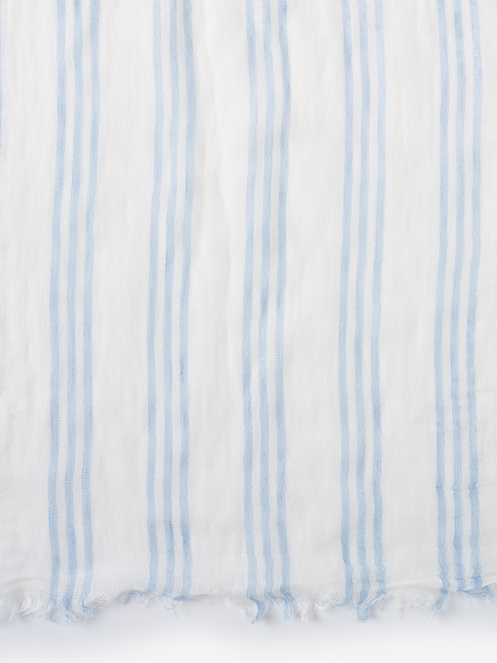 Lightweight Tessa Linen Scarf in Stripe by J.McLaughlin features soft blue and white stripes, crafted with innovative fabrics for effortlessly stylish, enduring designs. A destination for defining style. Life, Well-Lived.