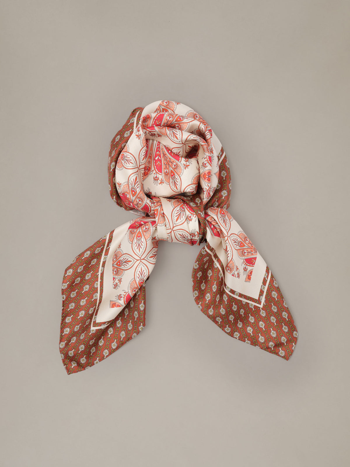 The Grace Silk Scarf in Neo Radiant Square by J.McLaughlin in red and cream with a paisley floral pattern styled in a soft knot ukiuni