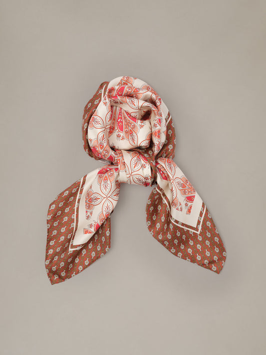 The Grace Silk Scarf in Neo Radiant Square by J.McLaughlin in red and cream with a paisley floral pattern styled in a soft knot ukiuni
