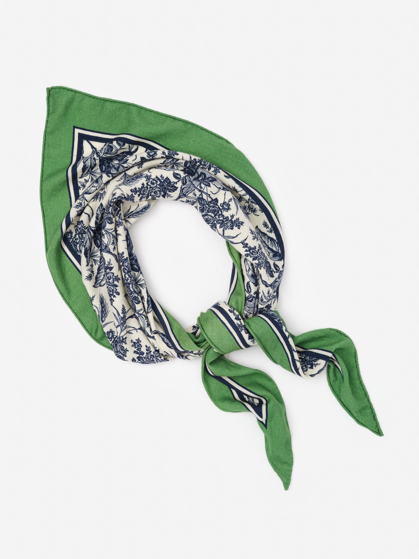 Sarita Scarf in Giardino Toile Corner by J.McLaughlin, a beautifully designed scarf featuring intricate blue floral patterns on cream with a green border, reflecting effortlessly stylish, enduring designs and a legacy of timeless fashion from a destination for defining style. Life, Well-Lived.