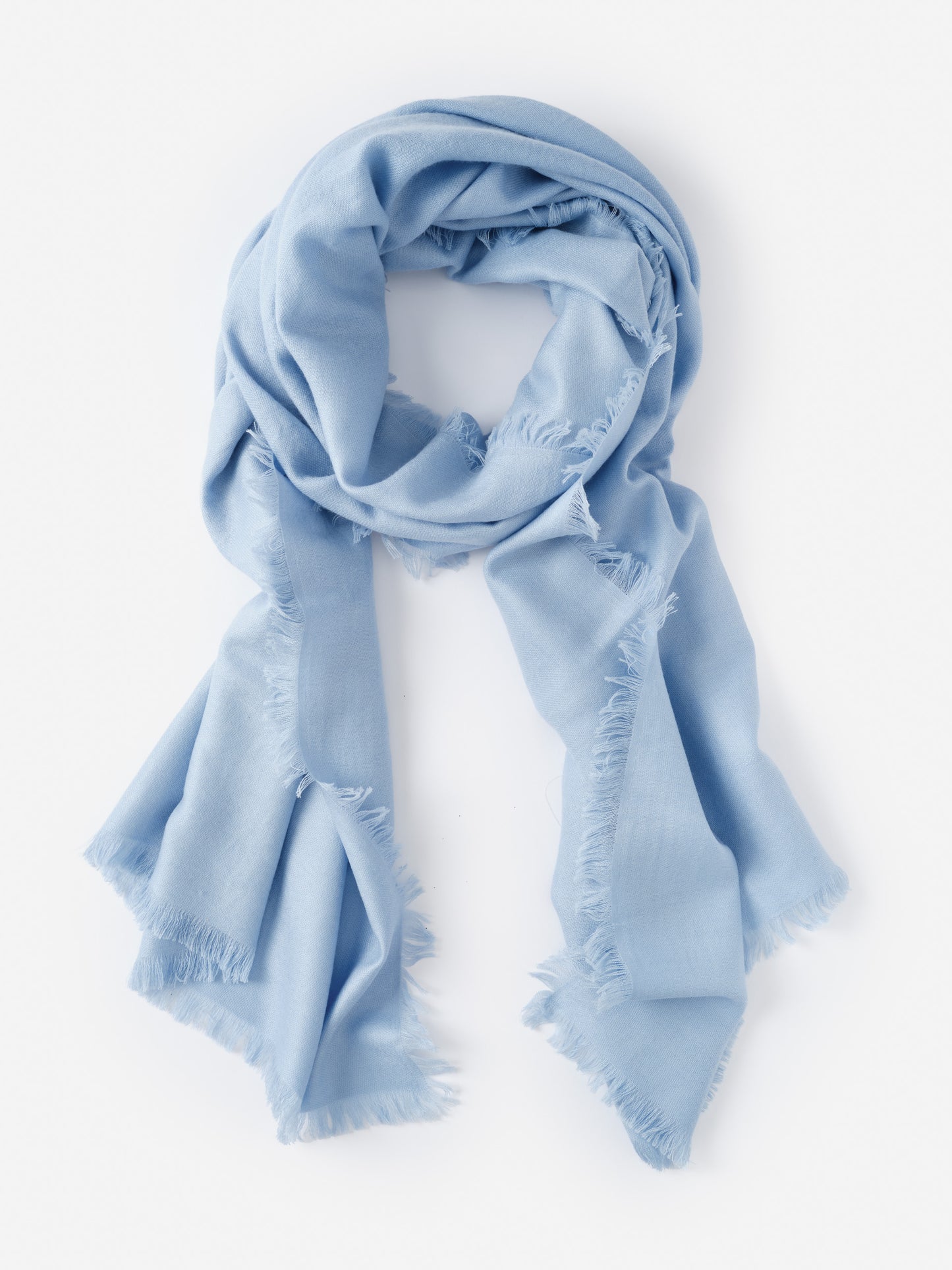 Soft light blue Carey Cashmere Scarf by J.McLaughlin featuring delicate fringed edges, embodying effortlessly stylish and enduring designs for a life well-lived.