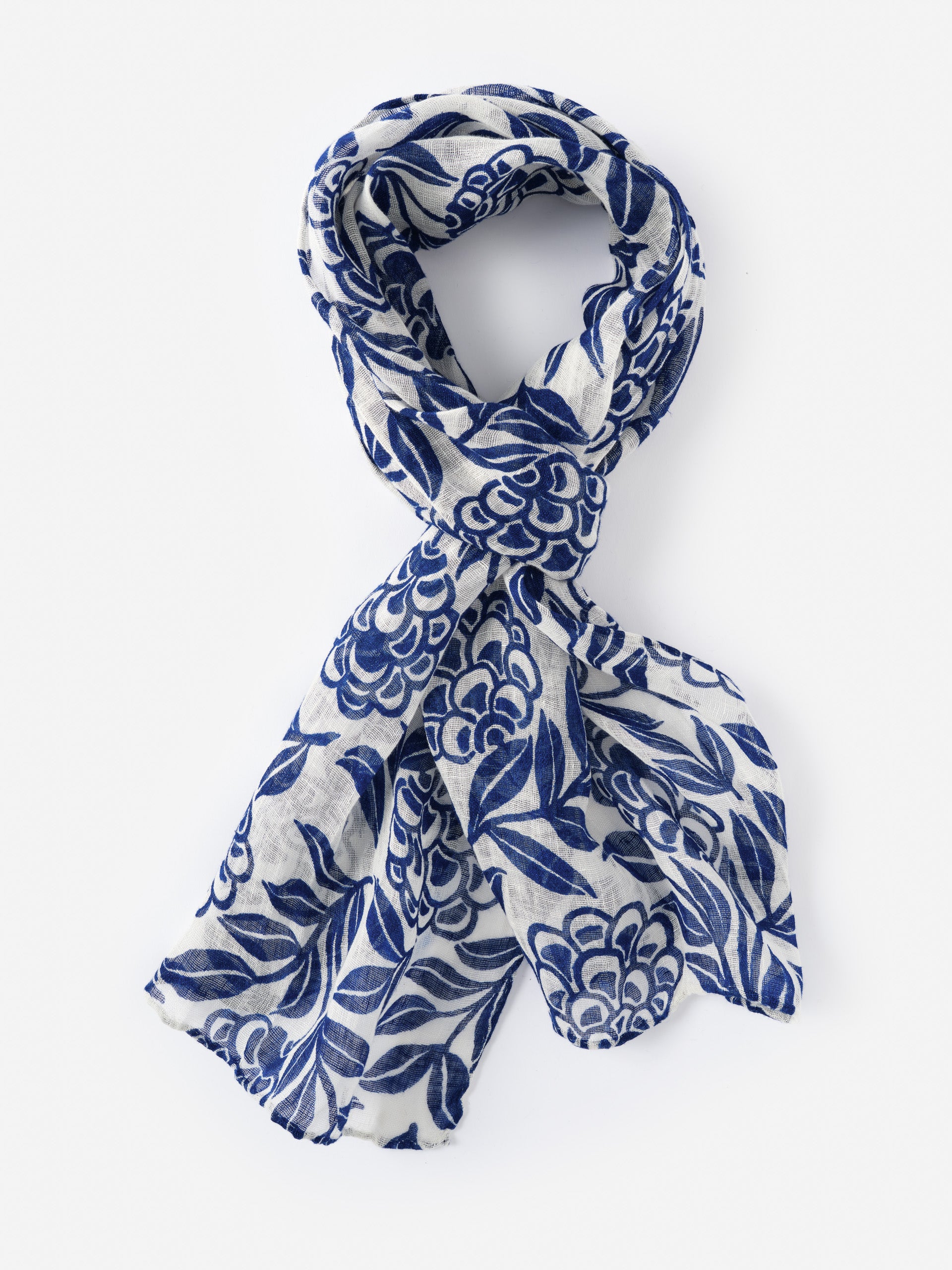 Men's Linen Scarf in Modern Dahlia by J.McLaughlin features a blue floral pattern on lightweight linen, combining effortlessly stylish design with enduring quality for a legacy of timeless fashion.