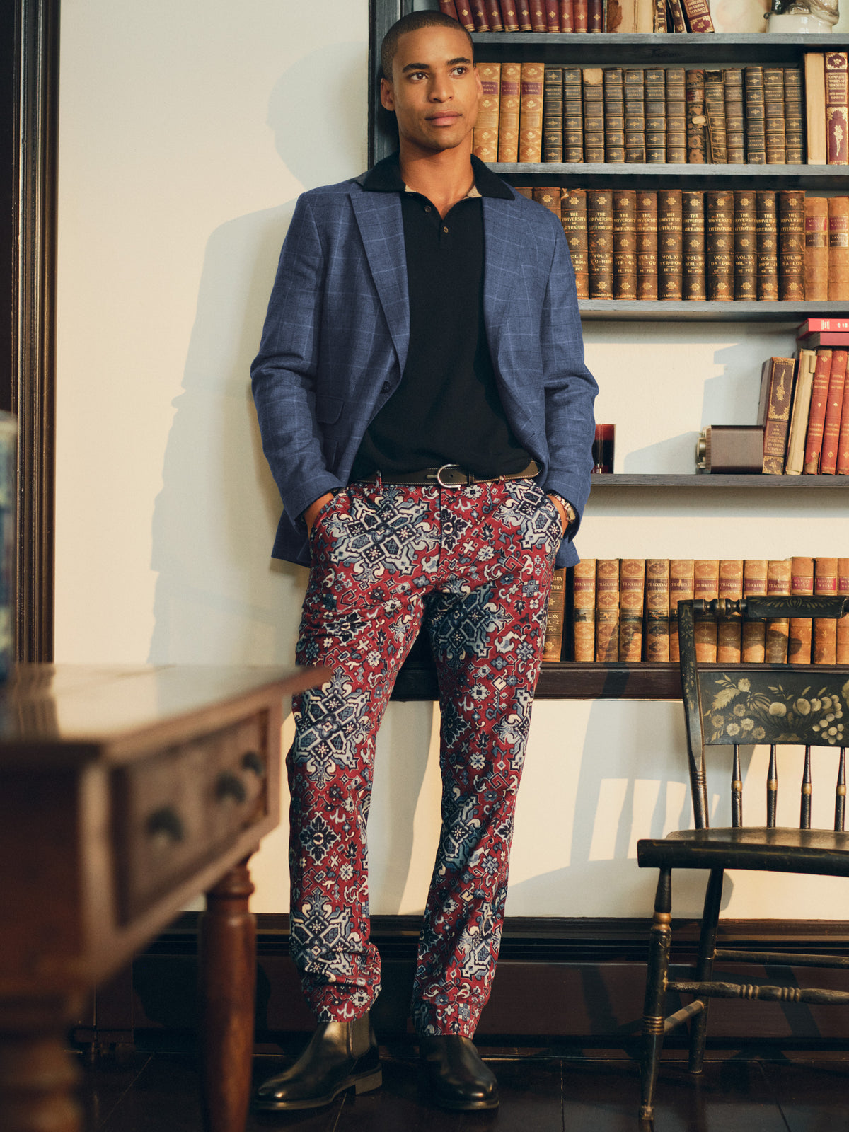 J.McLaughlin Madison Fancy Pants in Casbah Patch patterned pants styled with a navy blazer and black polo in a classic library setting