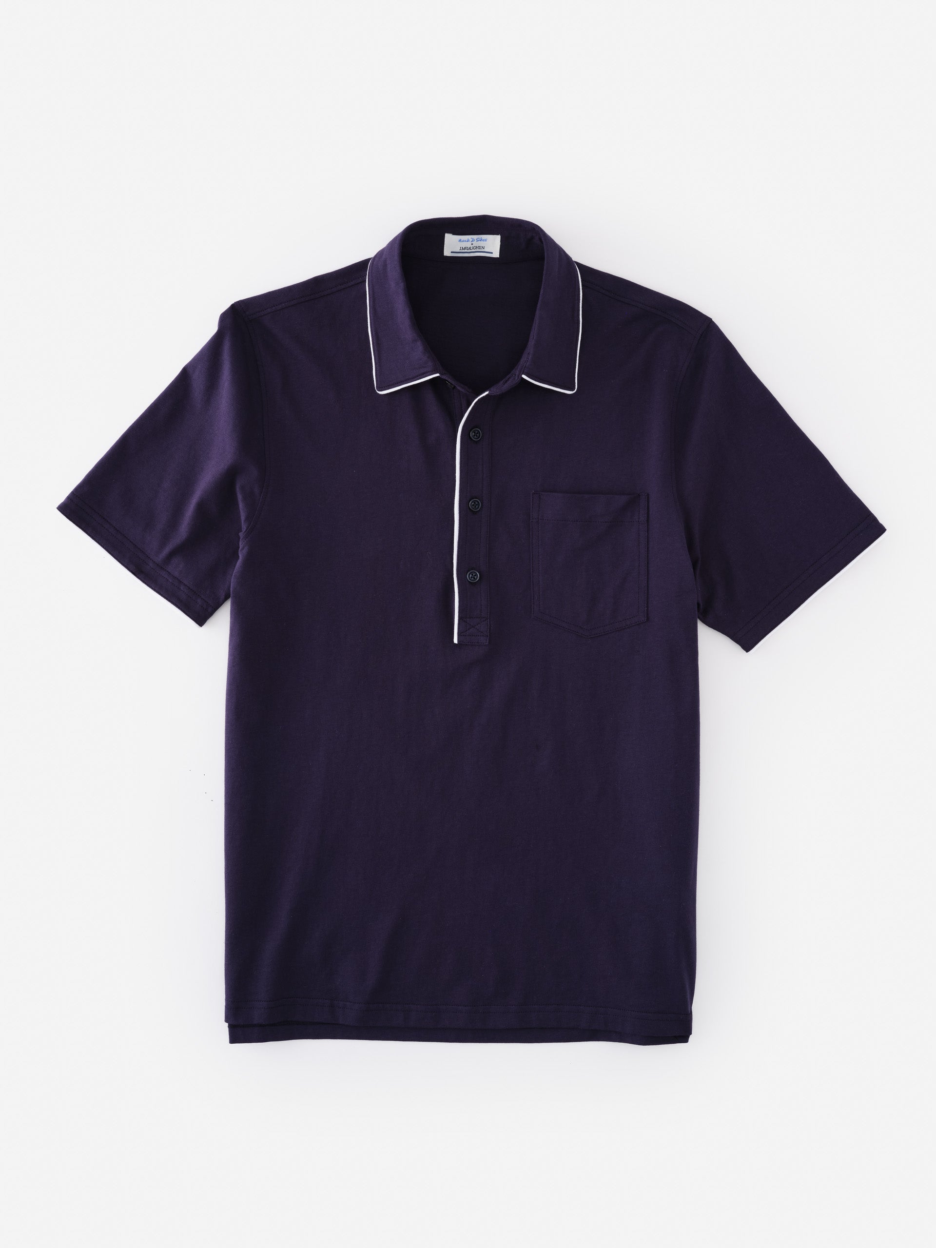 Ryan Polo by J.McLaughlin in deep navy with white piping, featuring a classic collar and chest pocket, showcasing effortlessly stylish and enduring designs in shirts. A destination for defining style. Life, Well-Lived.